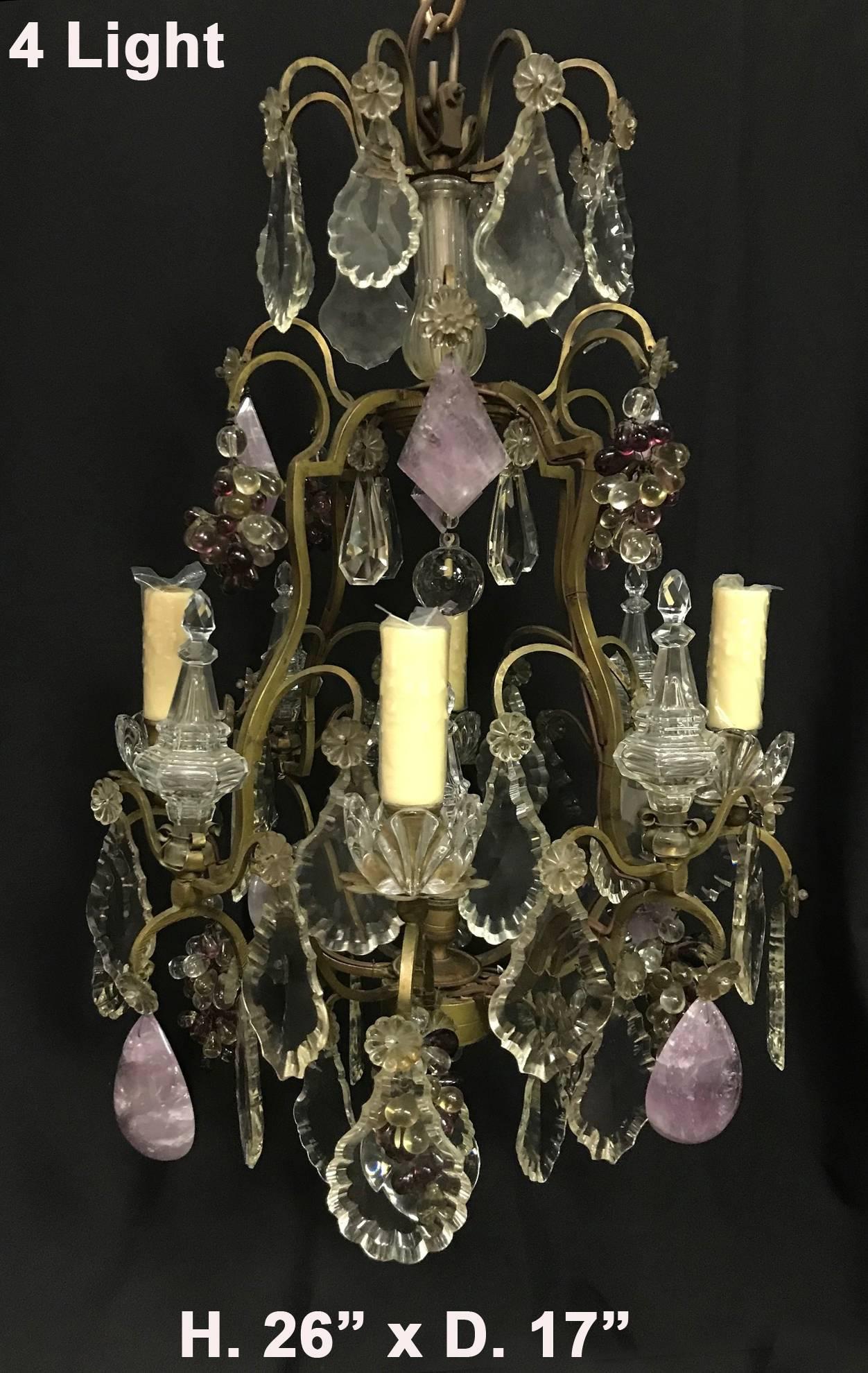 A lovely French antique Louis XV style Amethyst Quartz and cut crystal bronze four light chandelier.
Adorned with hand-carved and polished Amethyst Quartz, cut crystal, and Amethyst crystal grapes. 
Perfect for the powder room or walk-in closet.