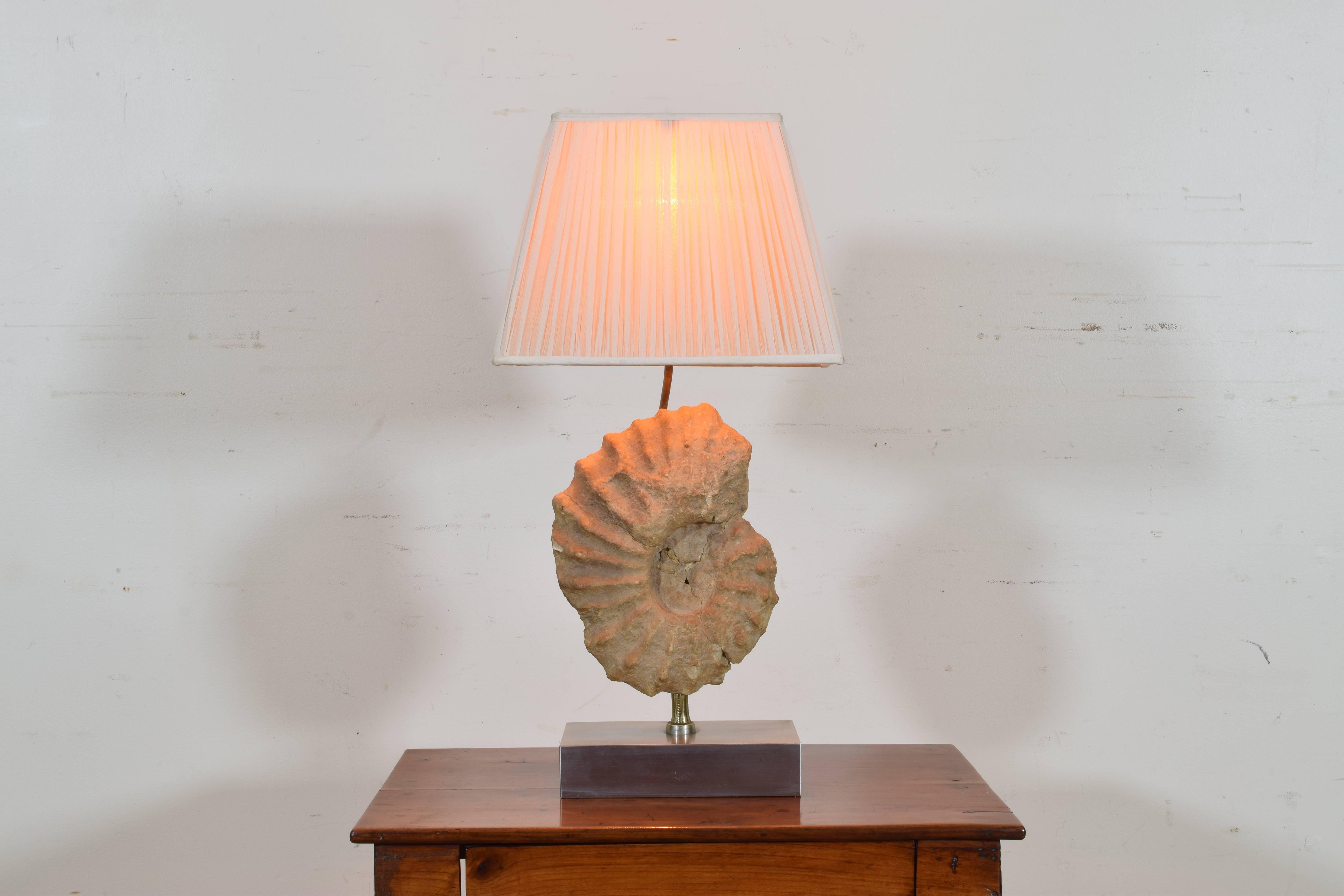 Probably mounted as a lamp in the mid-20th century, the ammonite having gone extinct some 65 million years ago.