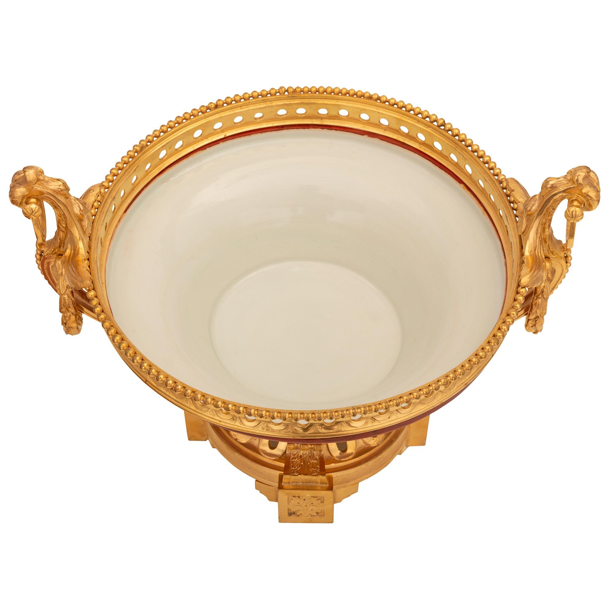 An exceptional and very unique French and Asian collaboration 19th century Louis XVI st. Belle Époque period Japanese lacquered, Kutani porcelain and ormolu potpourri centerpiece. The centerpiece is raised by a beautiful circular base with fine