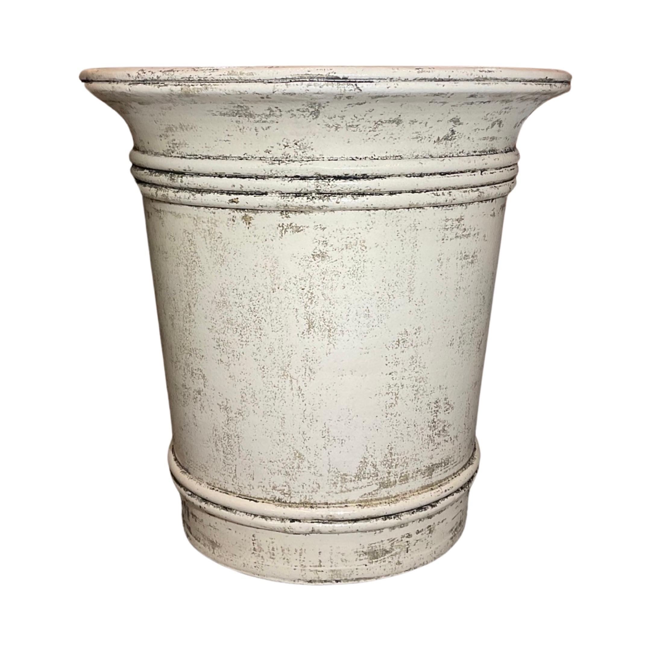 This anduze style French planter is from the 1940s and features an off white cream glaze finish with aged character wear. Hand-signed and sealed, this is an authentically elegant piece perfect for any garden. 