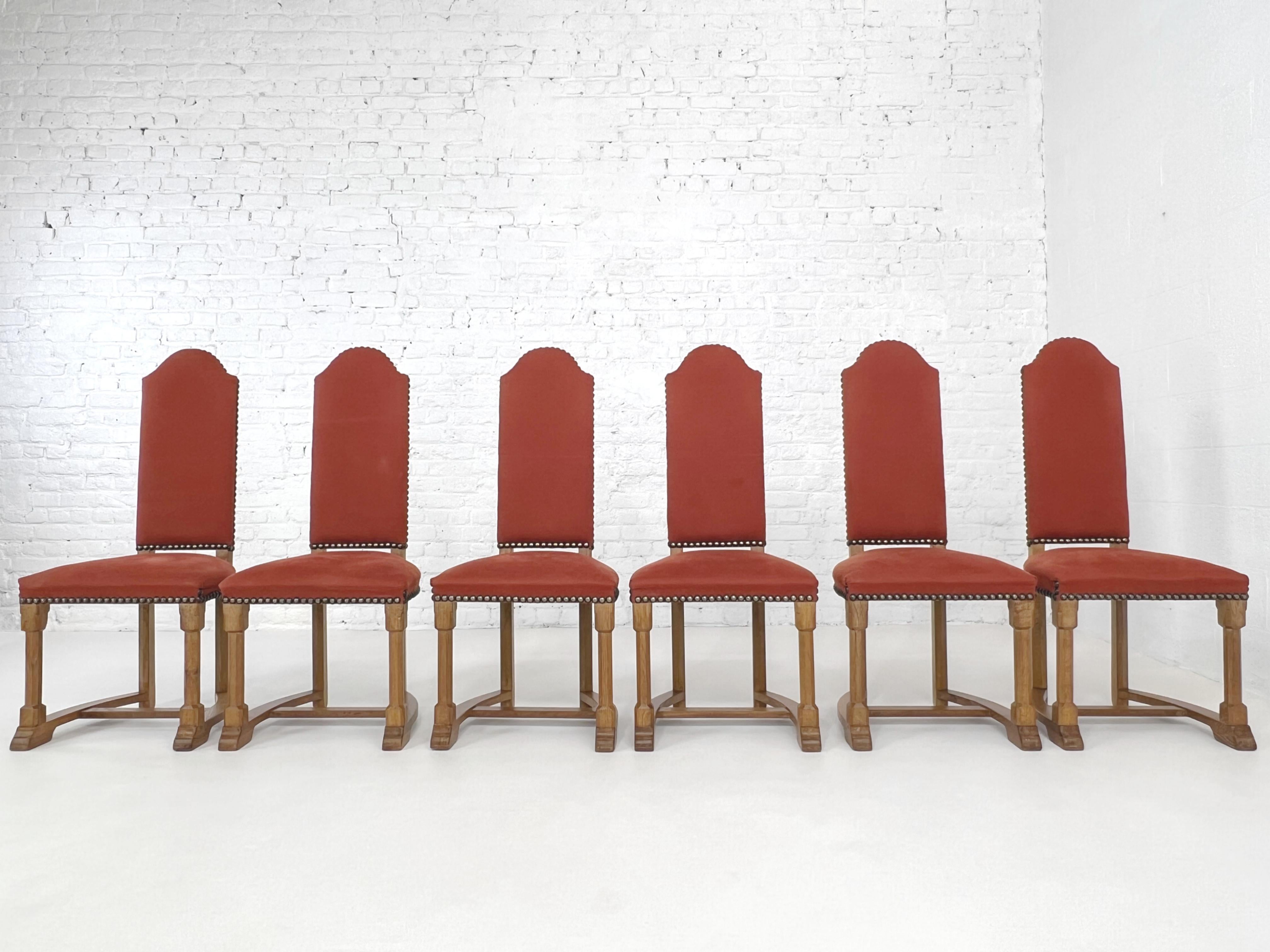 French Antic Louis XIII Style Wooden And Fabric Set of 6 Chairs With Their 2 Matching Armchairs composed of a curved and sculpted wooden high back structure adorned with brick red fabric.