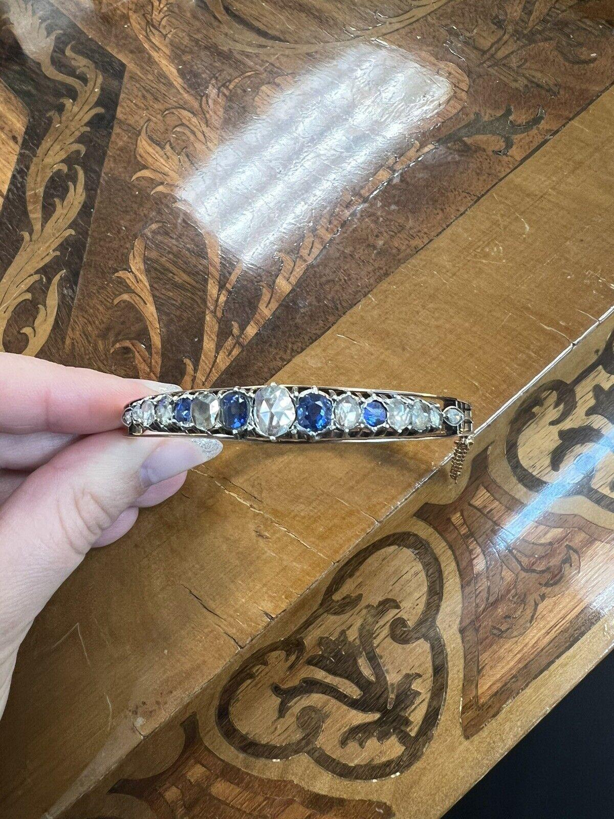 Antique French 18k Rose Gold, Rose Cut Diamond & Sapphire Bangle Bracelet Circa 1900s

Here is your chance to purchase a beautiful and highly collectible antique bangle.  

The length is 7.5