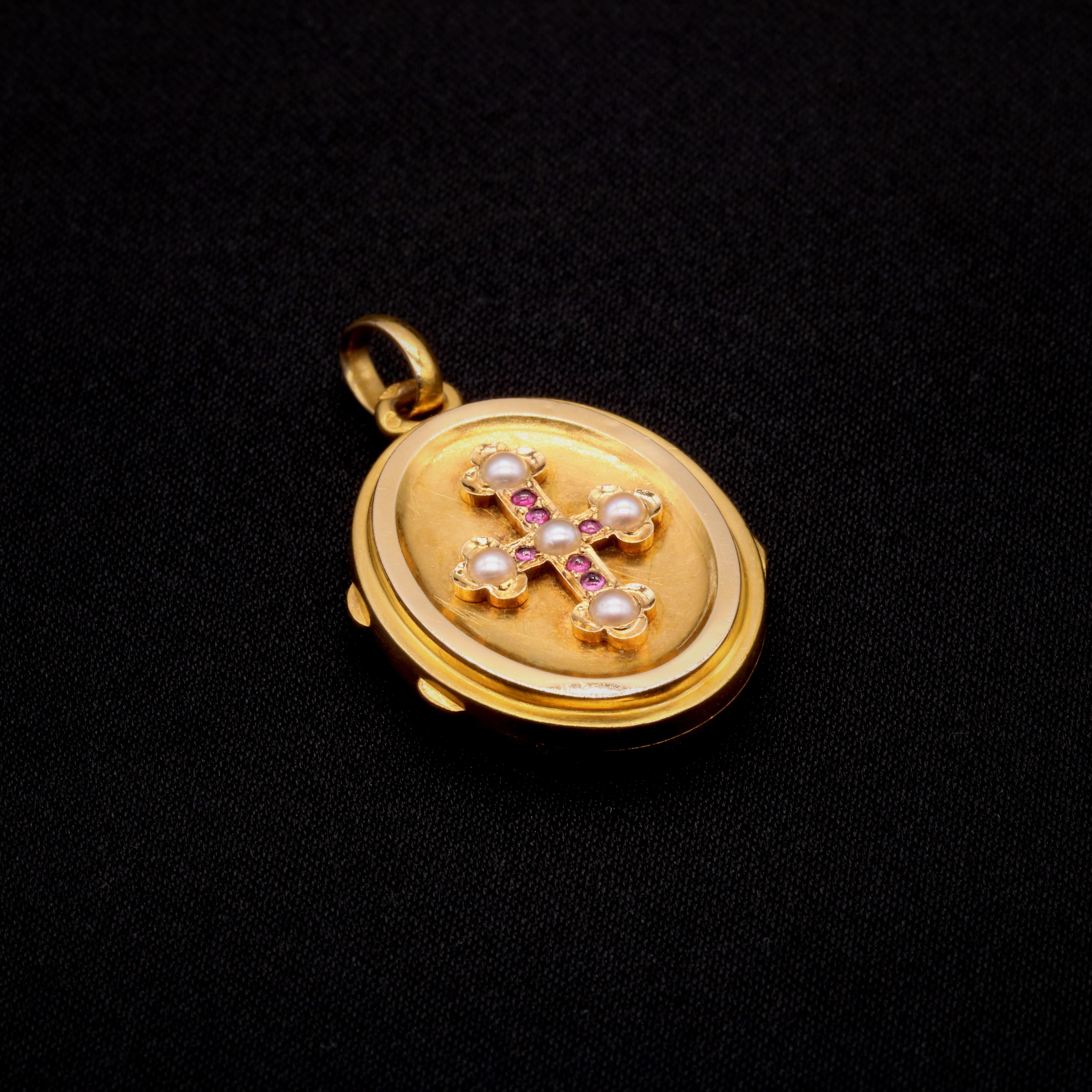 An antique ruby, pearl, and yellow gold locket, comprising five pearls, and six round ruby cabochons, in 18 karat yellow gold. 

My favourite thing about this Antique 18K Yellow Gold Ruby and Pearl Locket is the bejewelled cross. What’s yours?
