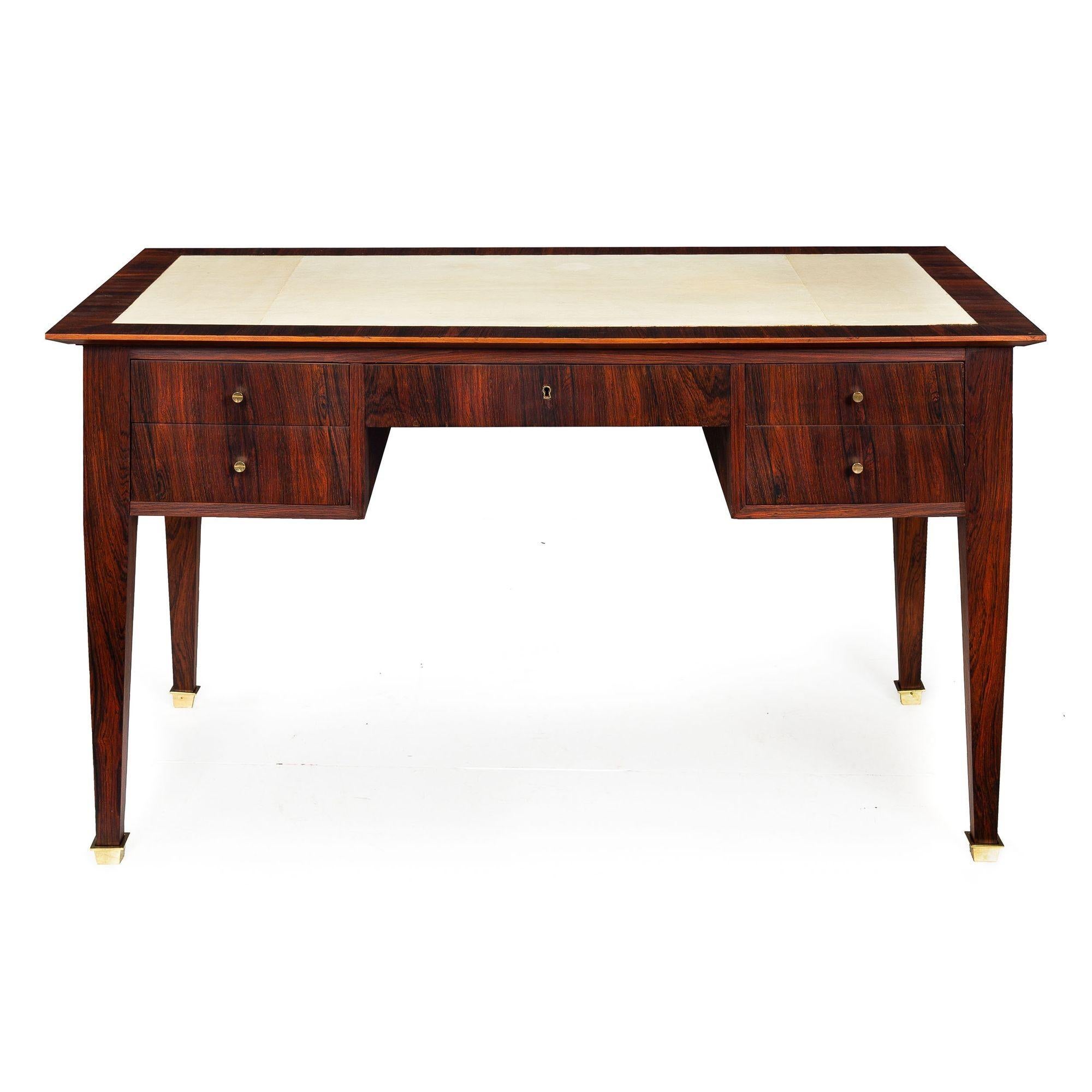 ART DECO MACASSAR EBONY, PARCHMENT AND BRASS BUREAU PLAT
Likely French, circa 1930
Item # 111PZN03Z 

A very fine Art Deco period bureau plat, it features chaotically grained Macassar ebony veneers throughout and retains the original lacquered