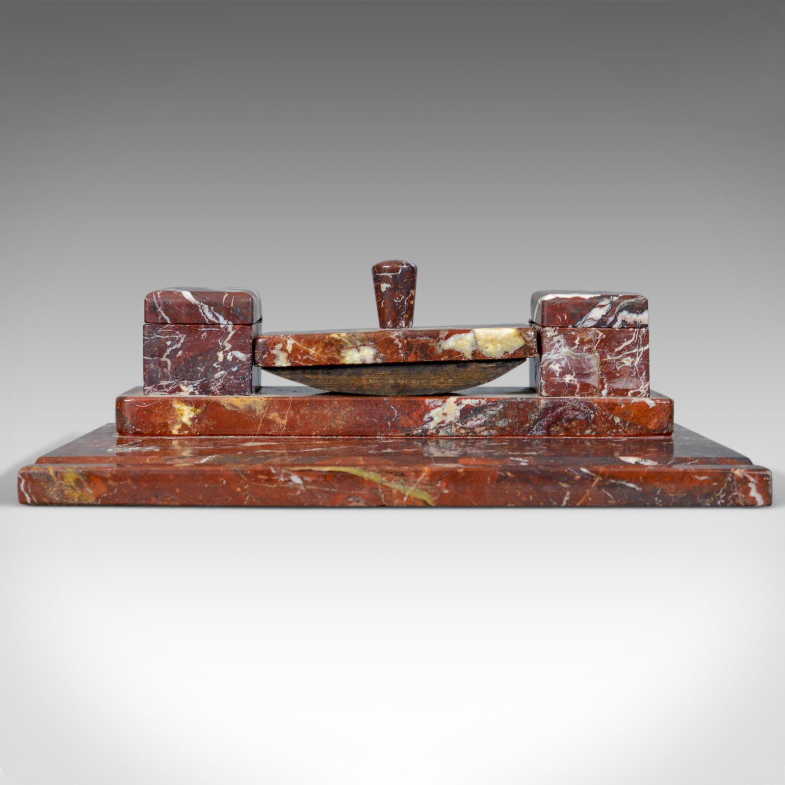 This is a French antique Art Deco marble desk stand. A large, heavy inkwell, pen rest and blotter dating to early 20th century, circa 1930.

A quality Art Deco desk stand in fine order
In attractively veined rouge marble
The platform with pen
