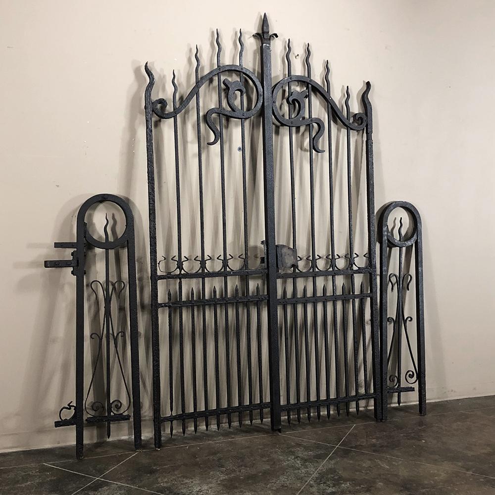 The most fabulous, rare French antique Art Nouveau period wrought iron gate set includes a gate and two extra panels, all hand-forged from solid iron over a century ago and features an array of Art Nouveau curves, swirls and acanthus leaf
