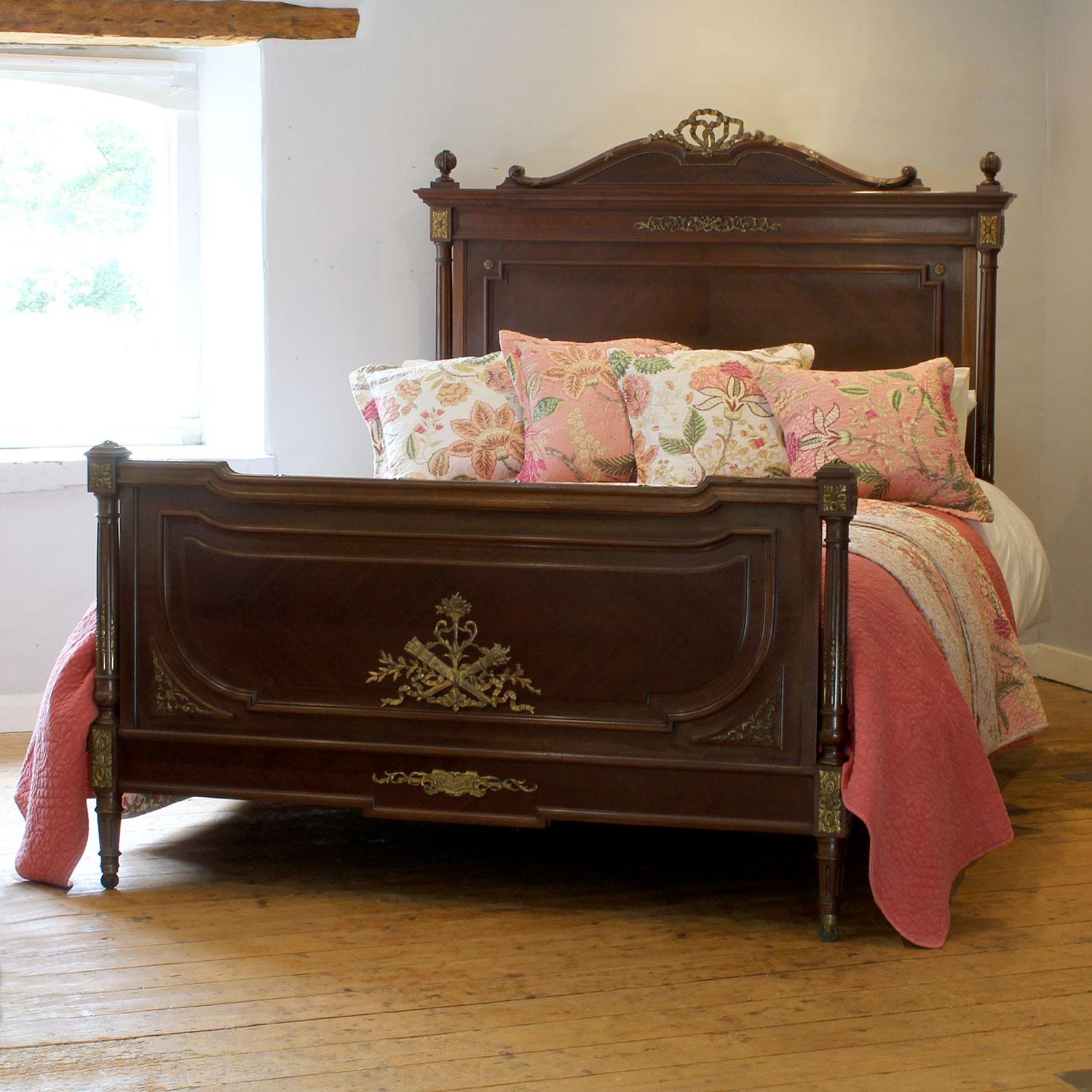 An attractive French antique bed with elegant shape, turned posts and ormolu decoration.

This bed accepts a US Queen Size (or UK King Size), 5ft wide (60 in), base and mattress set.

The price includes a firm bed base for the bed frame.

The