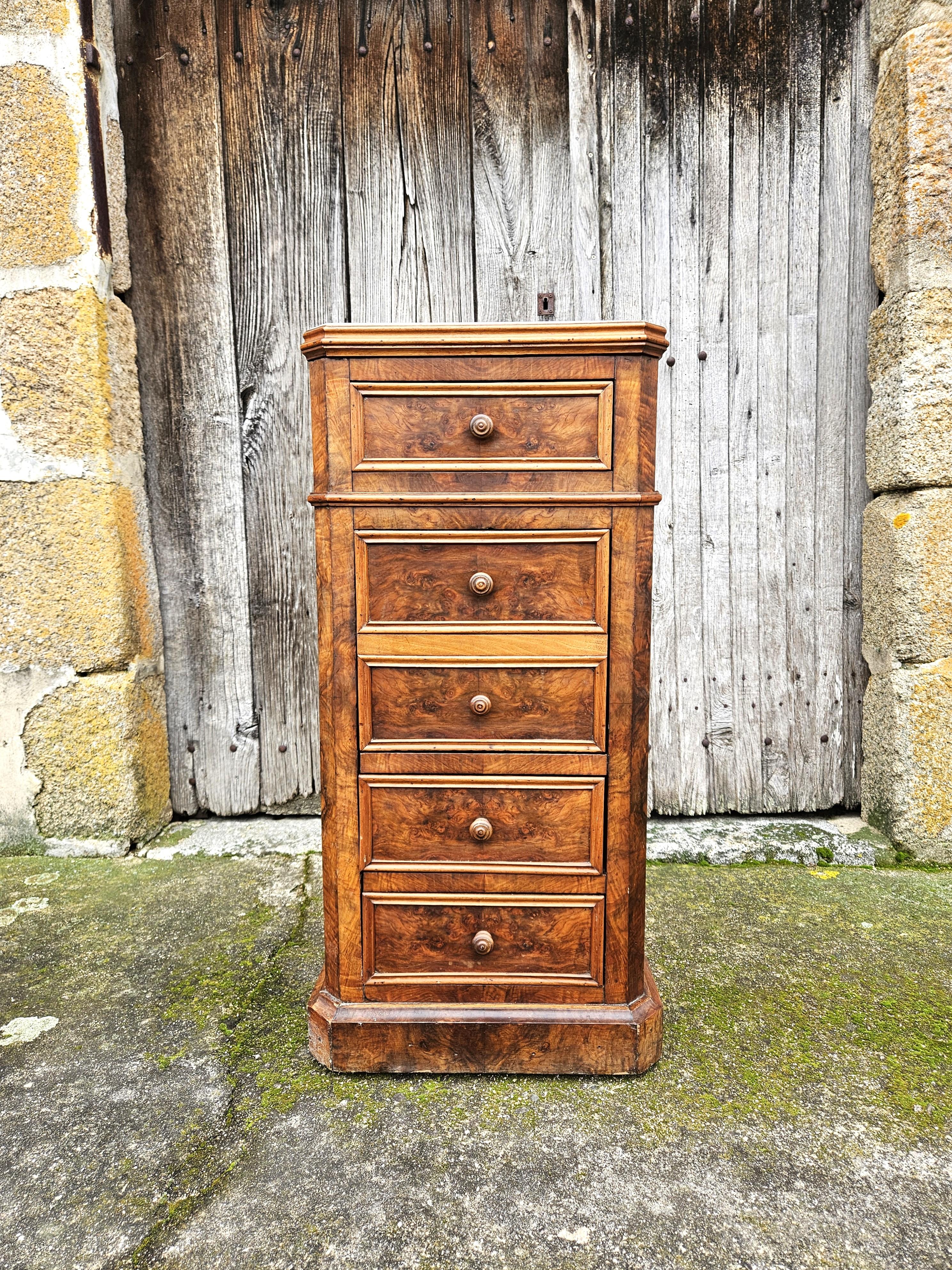 French Vintage Nightstand- Bedside Table - Bedside Console - Louis Philippe late 19th Century.
Made of Walnut with veneer of burled Walnut Front - very solid handicraft .
It has three Drawers and a Door that hinges open to reveal an Interior