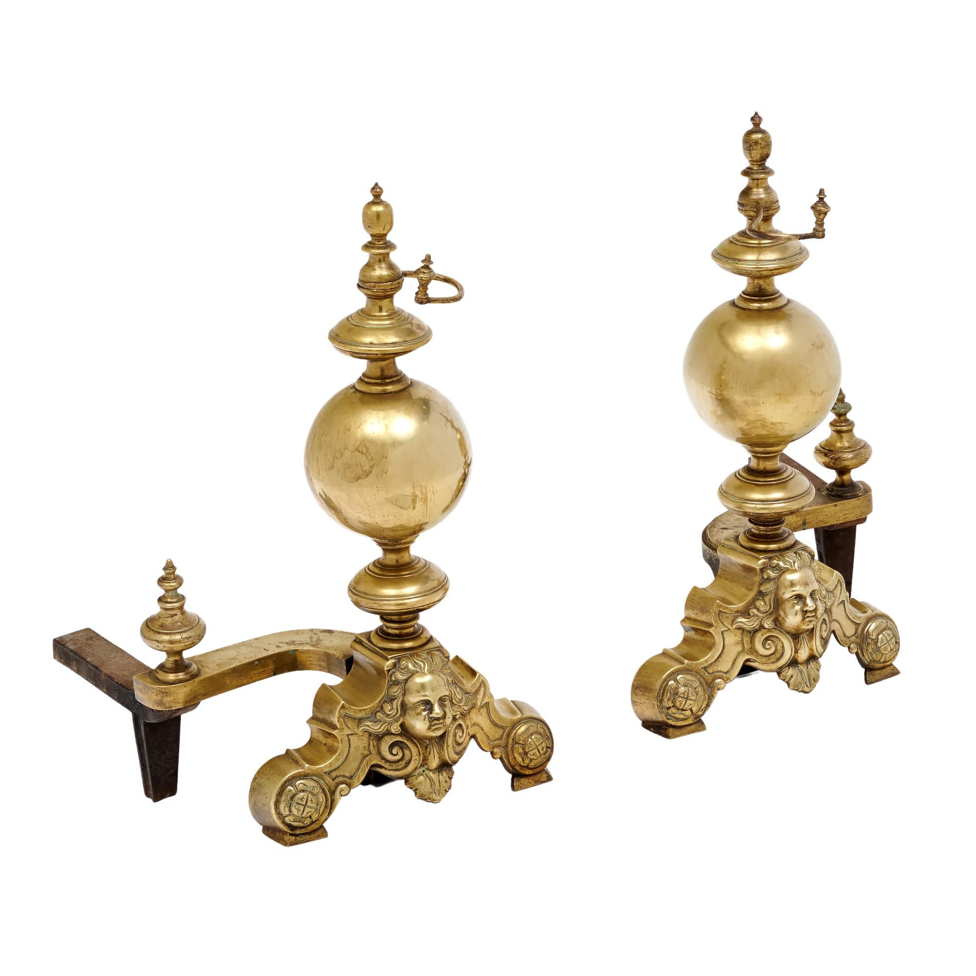 A pair of French antique andirons made of finely cast bronze. These pieces are adorned with the face of Beethoven. They are in very nice antique condition with only minor surface wear consistent with age and use. The photos accurately depict the
