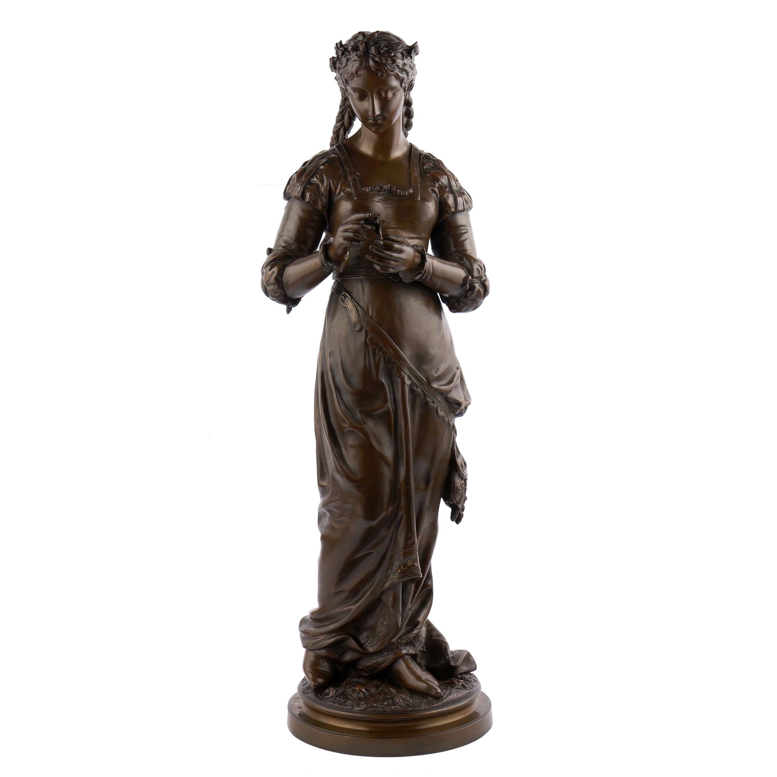 Steeped in the romantic, this gorgeous figural sculpture was modelled by Charles Anfrie (French, 1833-1905) first as a group with a young man having handed this flower to the girl in an attempt to garner her affections. That model suggests what
