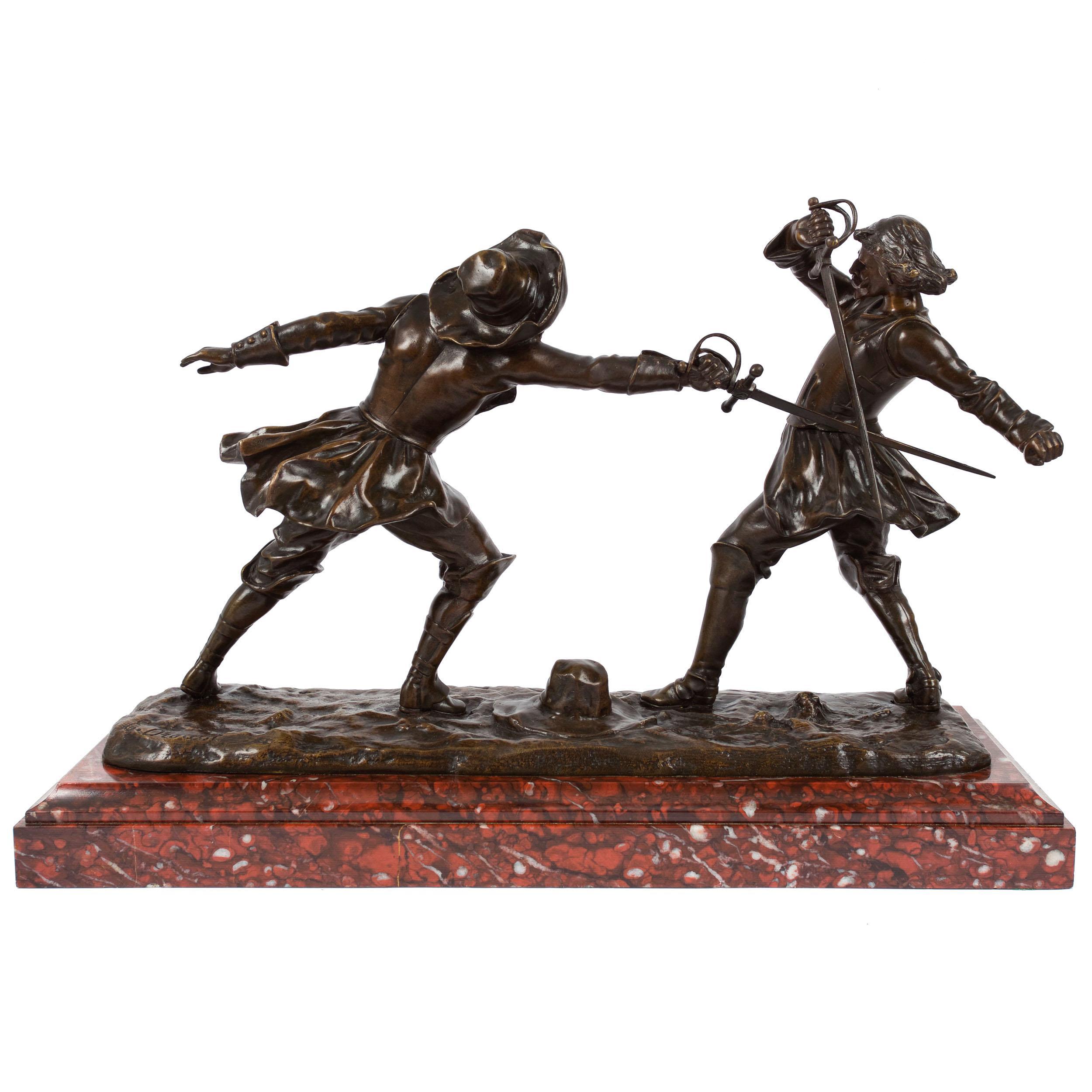 An infrequently scene sculpture by Drouot, it is an engaging historical genre scene depicting two dueling cavaliers complete in period garment. His modeling of both is most convincing with one figure lunging forward with his rapier while the other