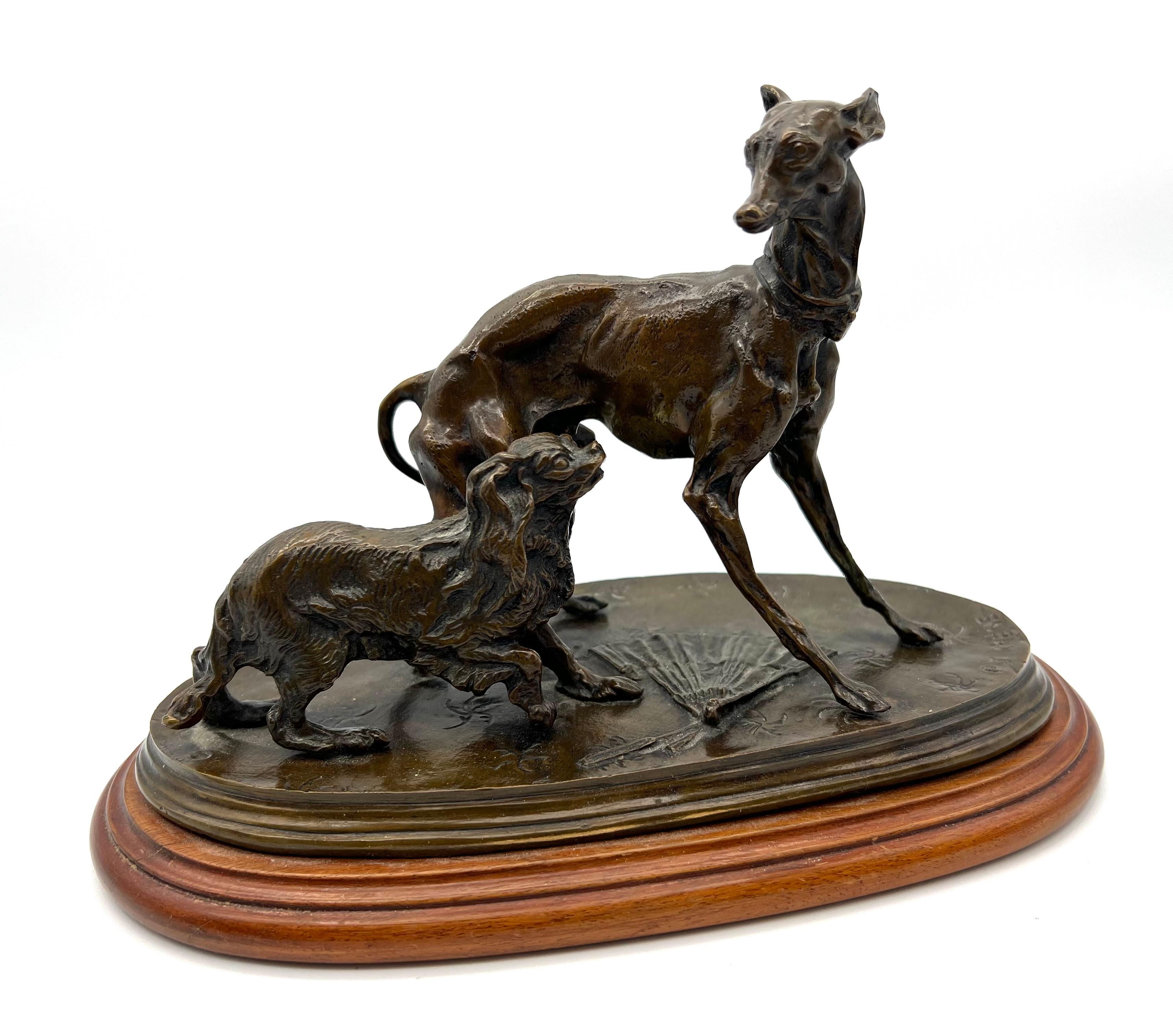 Superb bronze animal group with brown patina representing two dogs, a greyhound and a King - Charles , by Pierre - Jules Mêne .
Signature of the sculptor 