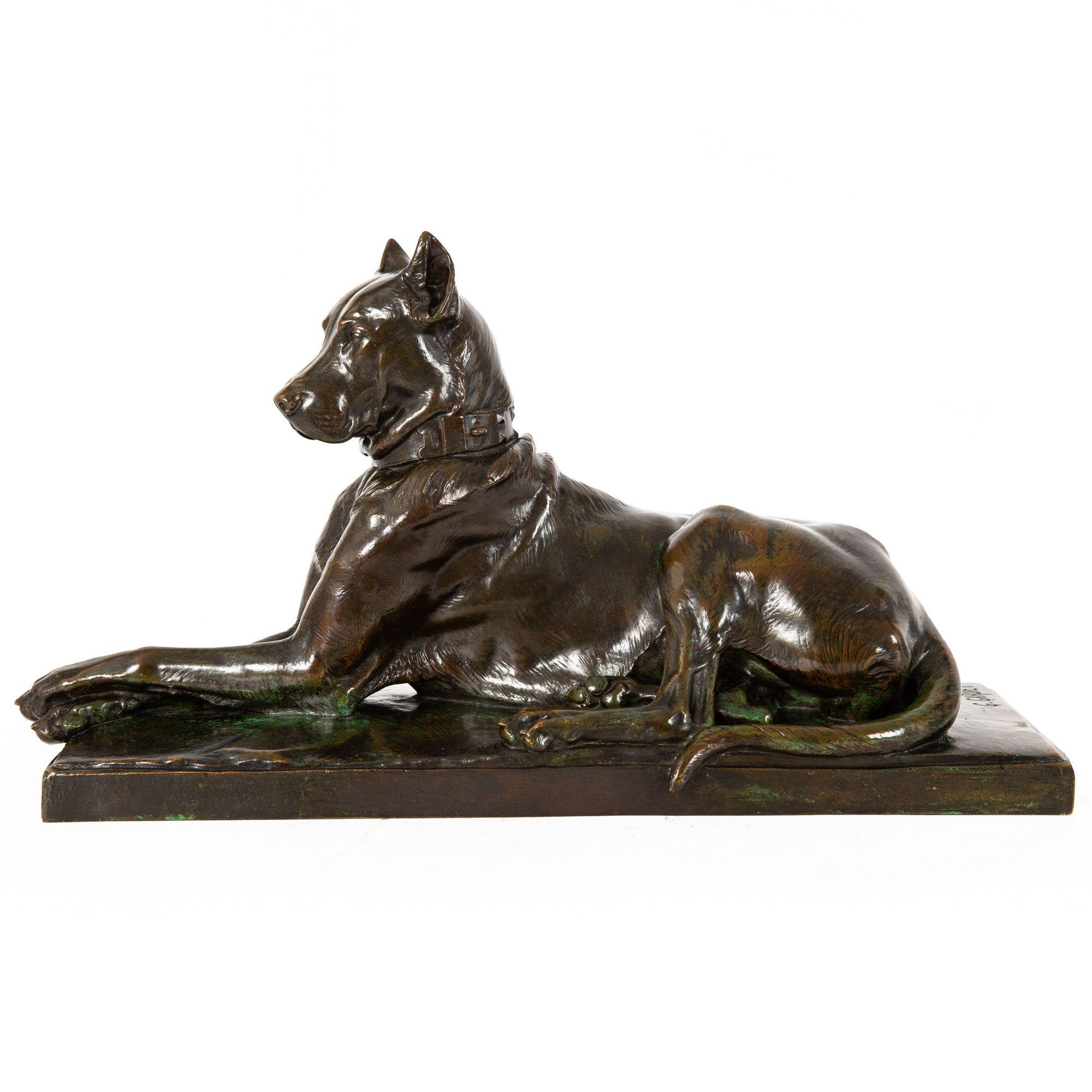 An exquisite casting of Gardet's Recumbent Great Dane with a nuanced black-over-medium-brown patination highlighted by trace verdigris, it is a silky cast with an underlying sensitivity in the modeling that casts a certain bokeh quality over the
