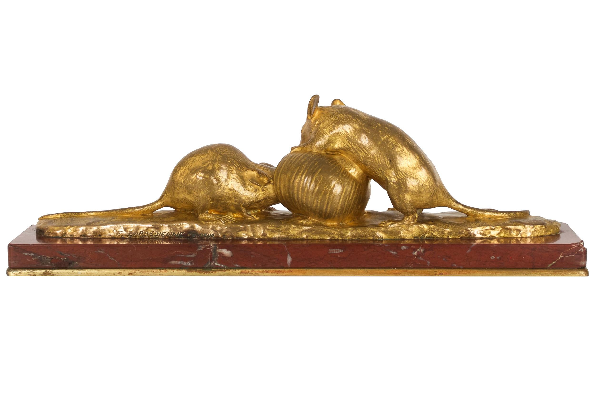 An exquisitely cast model of two mice engrossed in their discovery of a snail shell. The circa 1897 bisque cast model executed by Sèvres is held in the permanent collection of the Museé d' Orsay in Paris (acc. no. OAO 162) and was presented at the