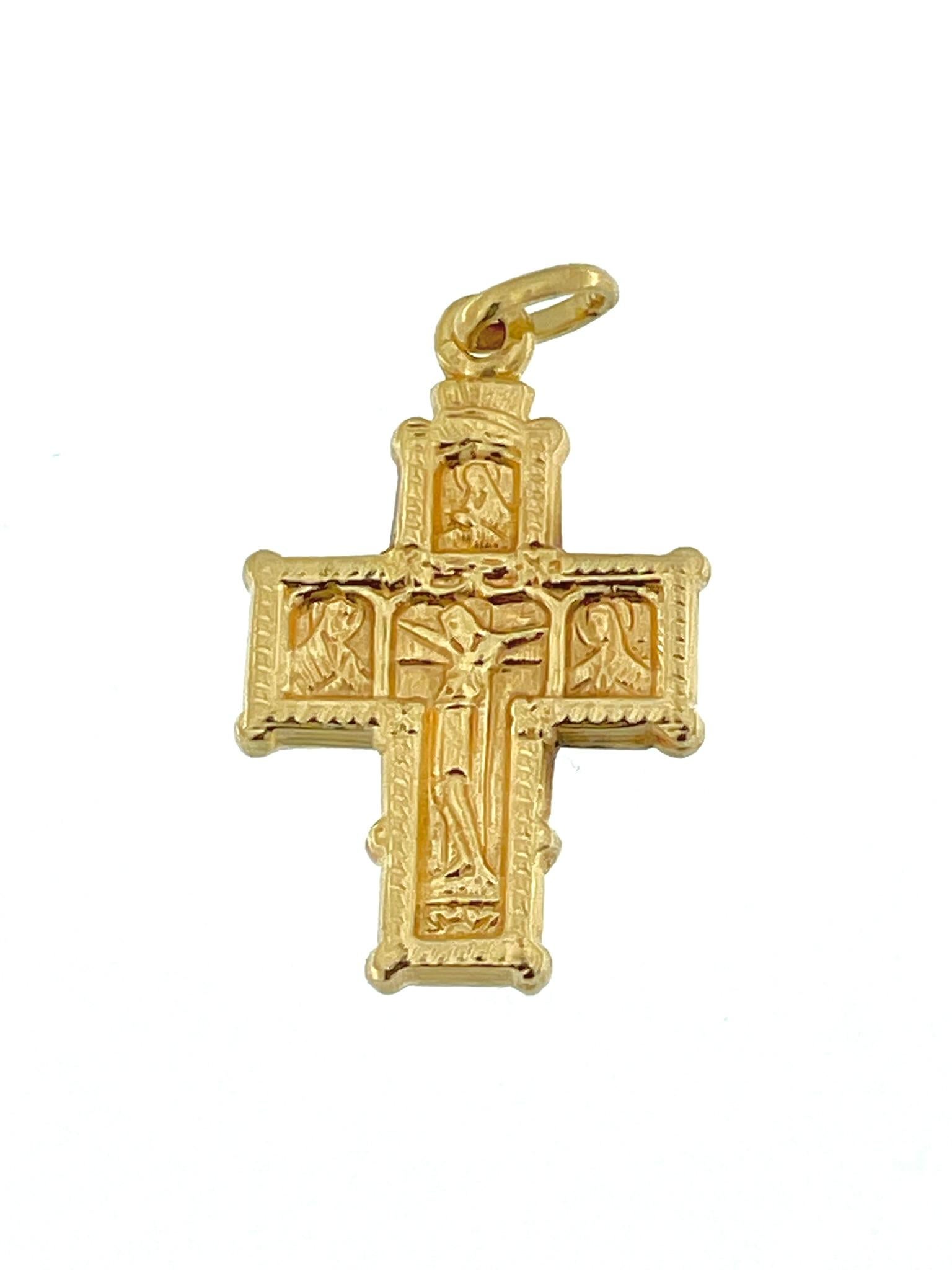 The French Antique Byzantine Style Crucifix is a stunning piece of religious artistry crafted with meticulous attention to detail. It is made from 18kt yellow gold, providing a luxurious and timeless appeal. The crucifix follows the Byzantine style,