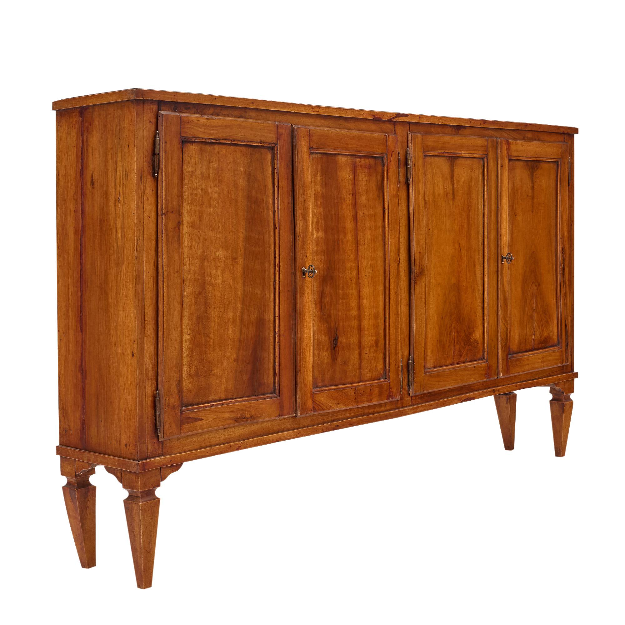 Cabinet or console from a restaurant in Avignon in the south of France, made of walnut and featuring two pairs of doors that open outwards to interior shelving. The beautiful honey tone of the walnut makes this shallow piece inviting and perfect for