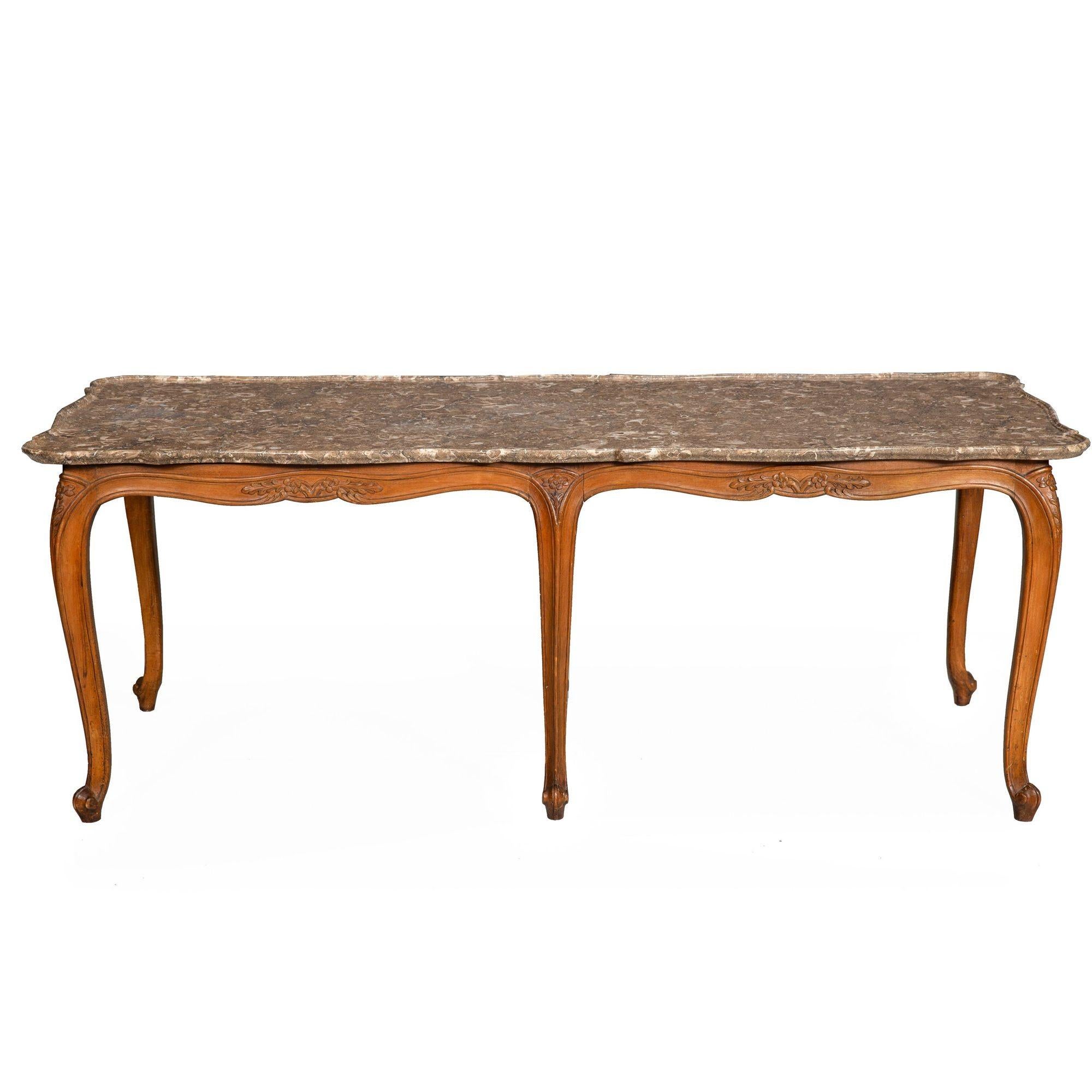 CARVED WALNUT MARBLE-TOP LOW COFFEE TABLE IN THE LOUIS XV TASTE
France, circa 1900
Item # 403KQO18P

A wonderful French coffee table with the most spectacular marble top - this gorgeous fosselized stone top features a scooped edge carved of the