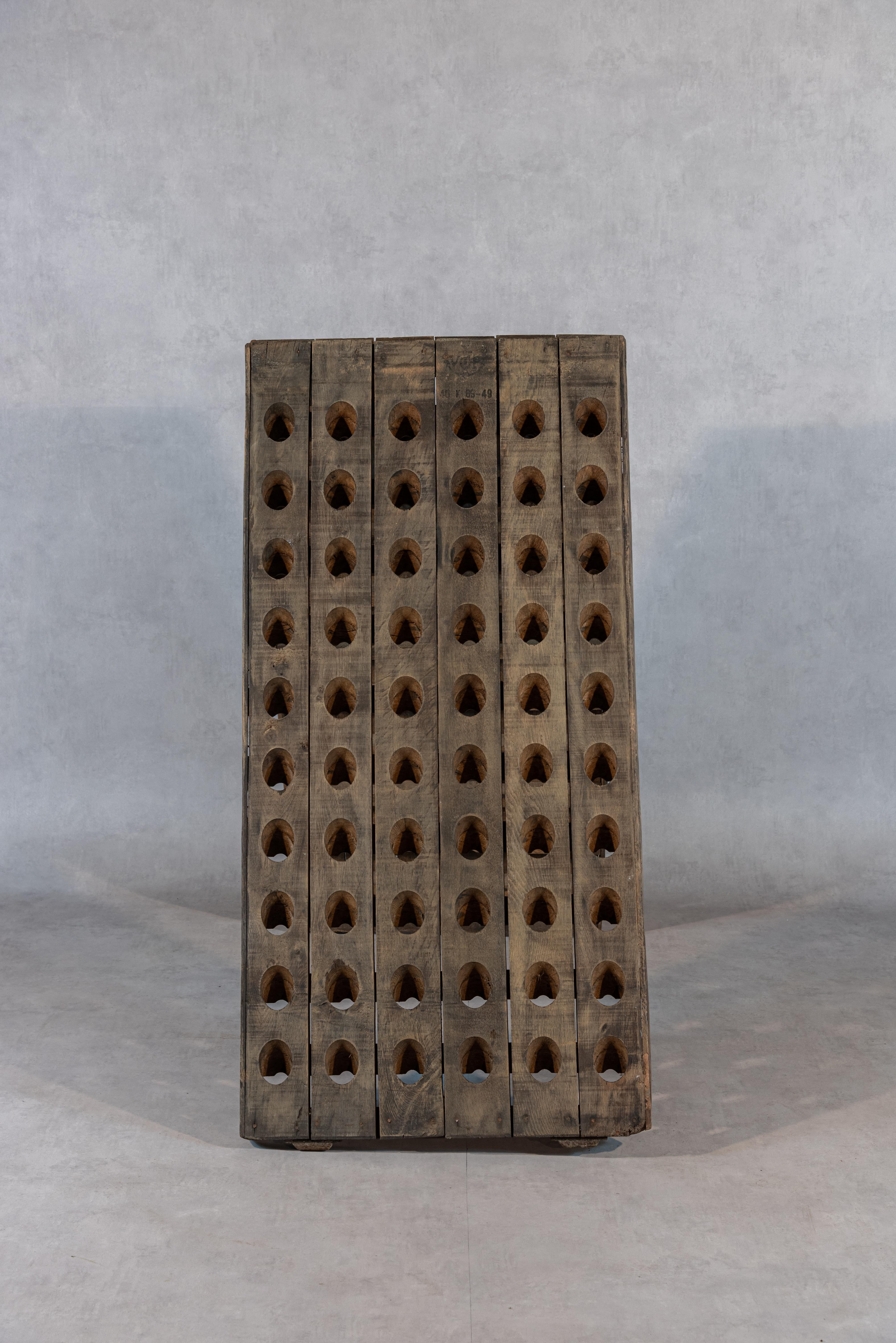 This stunning 19th-century French champagne riddler or wine rack is a true masterpiece that exudes the charm and appeal of a French chateau. With a capacity for 120 bottles, it is both practical and beautiful, making it the perfect addition to any