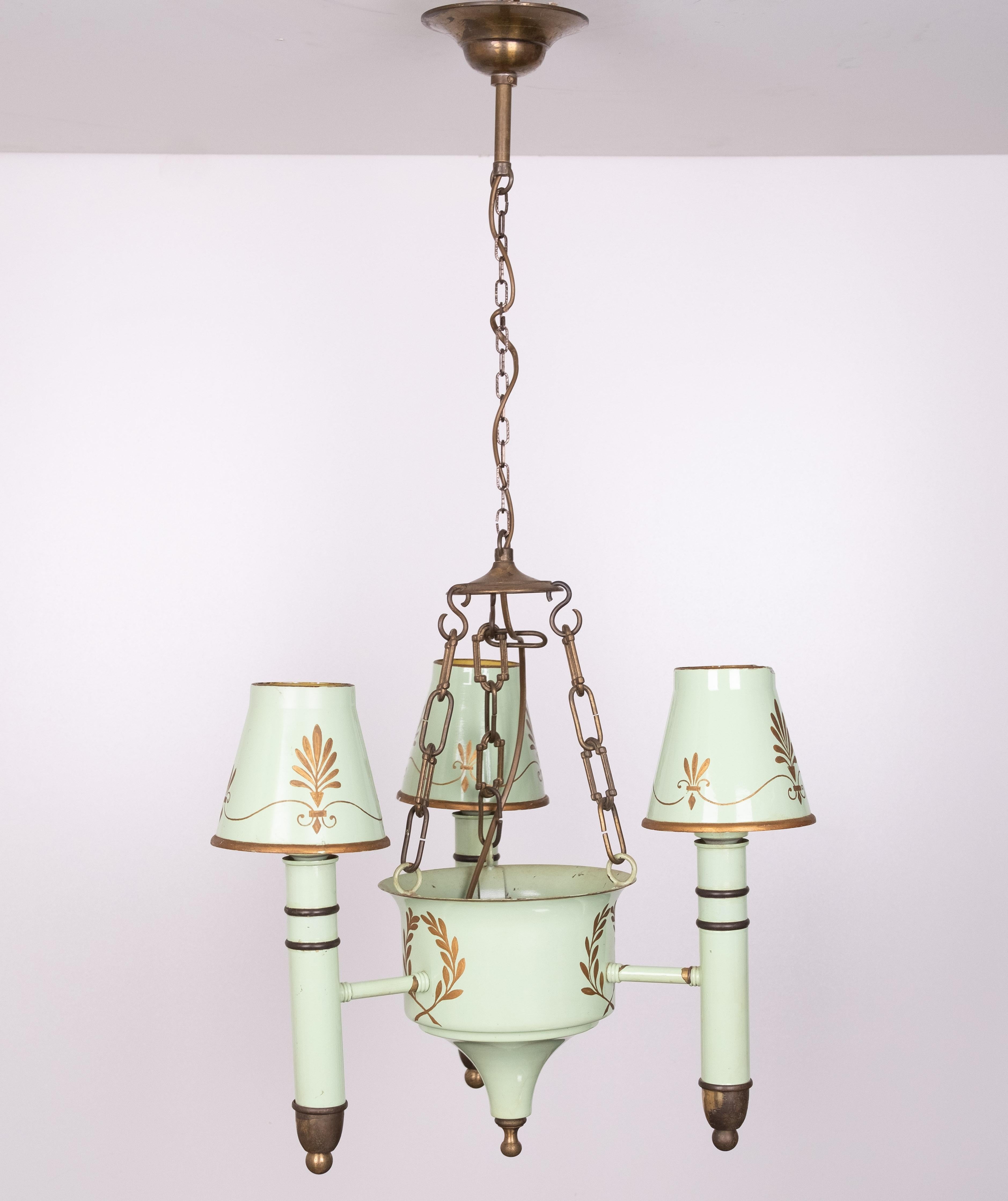 Antique French Empire Directoire green tole paint Four lights chandelier.
Great color and detail with gold plated stencils.
Dating from the middle of the 20th century