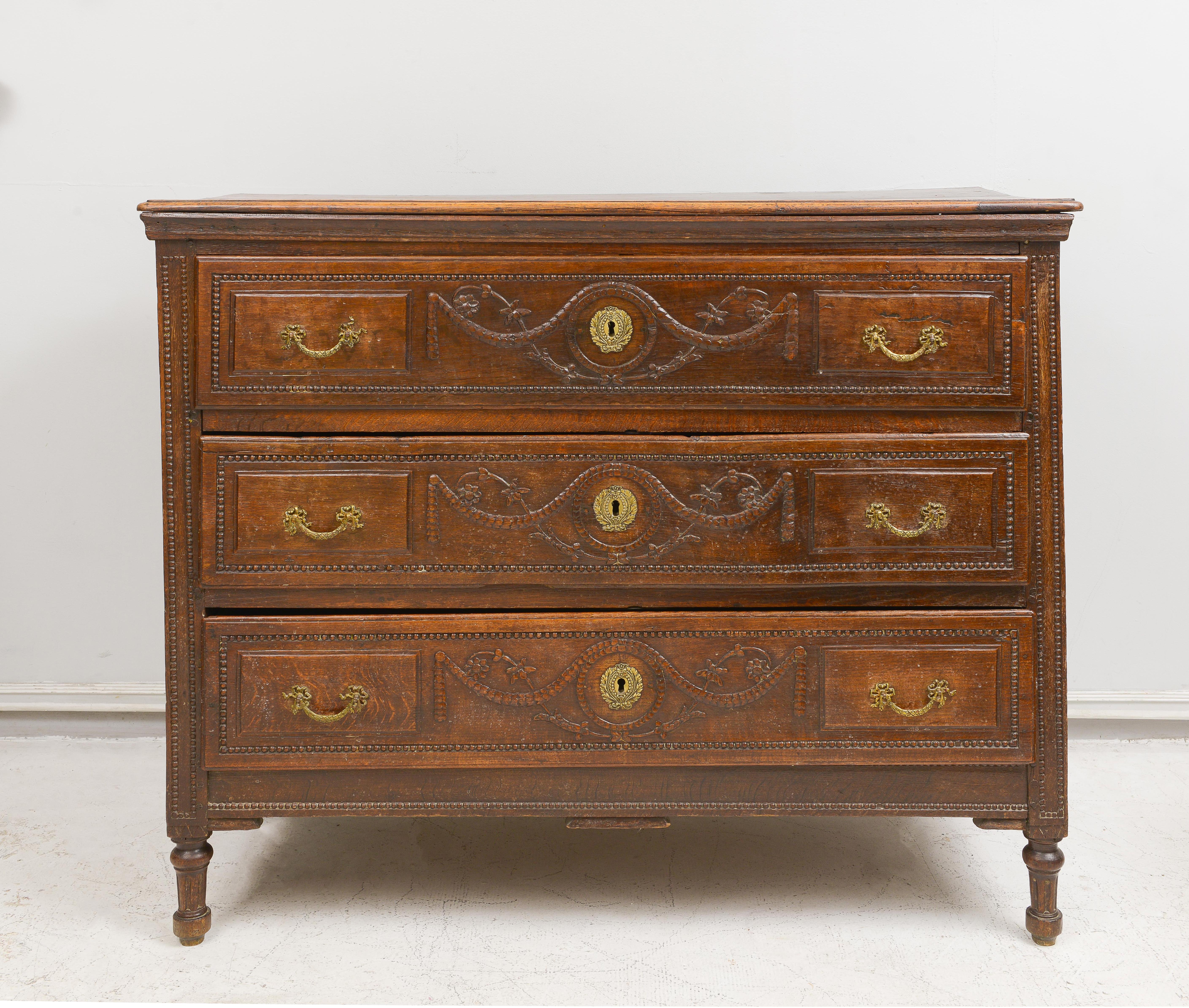 French antique chest of drawers/commode with hand-carved swags.