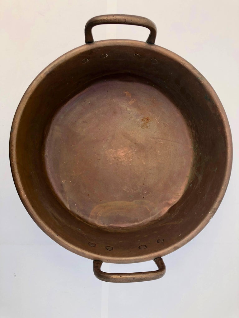This French antique copper preserving pan with wrought iron handles was used to bake jam or other sweet food in the 1800s. The three reasons why these copper pans work so well is that it- evenly spreads the heat and, since most fruit contain pectin