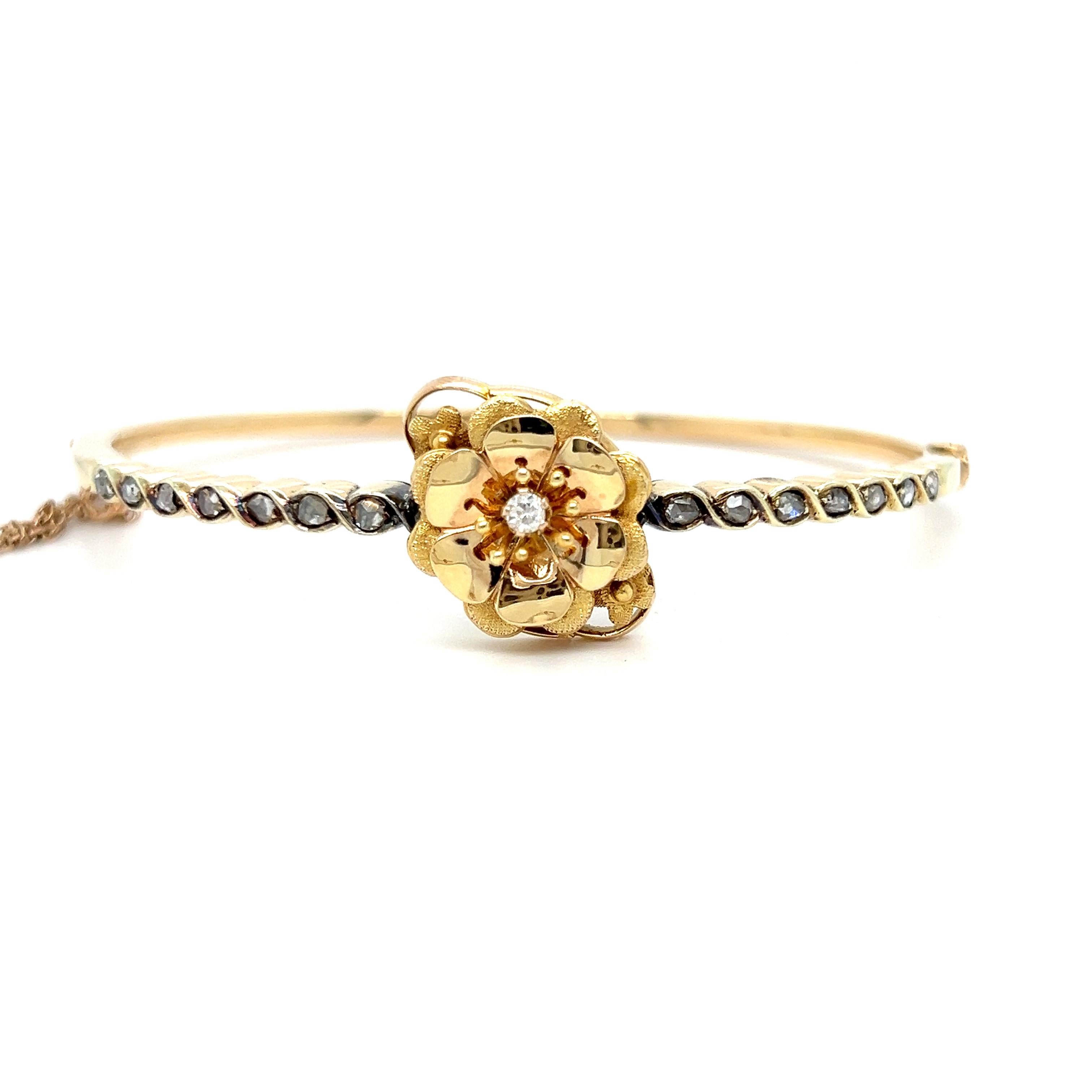 This Stunning French Antique Diamond 18K Yellow Gold Hinged Floral Bangle Bracelet is a a unique antique! Crafted in 18K Yellow Gold, with French Hallmarks, the design features a lovely little flower with a diamond center, with Antique rose Cut