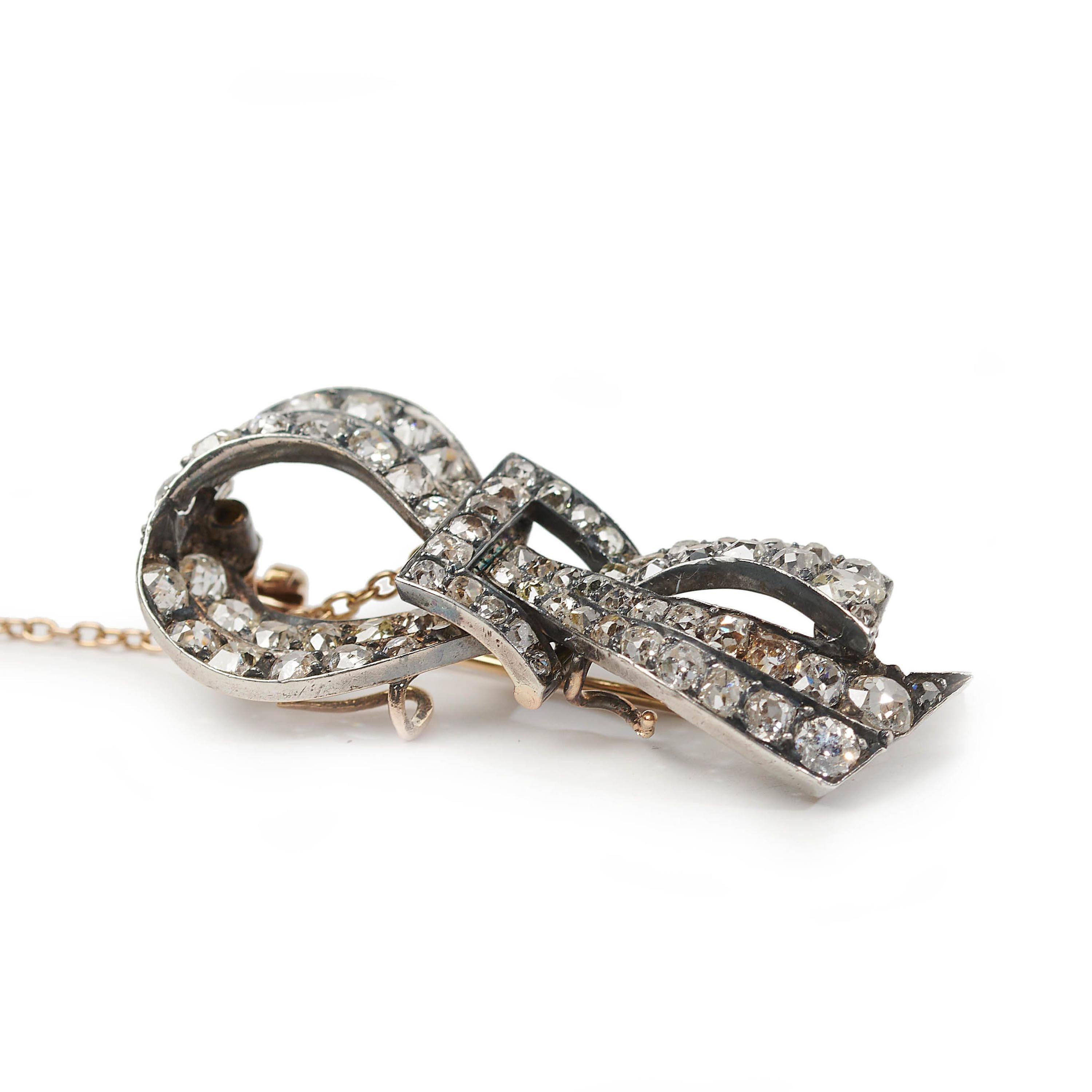 Women's French Antique Diamond and Silver Upon Gold Bow Brooch, circa 1880 For Sale