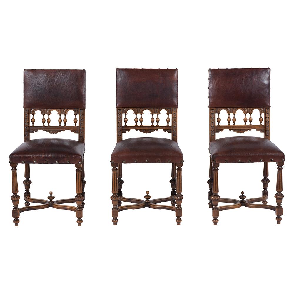 A set of six French Late 19th Century Renaissance Dining Chairs that have been completed restored, are crafted out of solid walnut wood with an original color stain and have been freshly waxed giving it a patina finish. This set features the seats