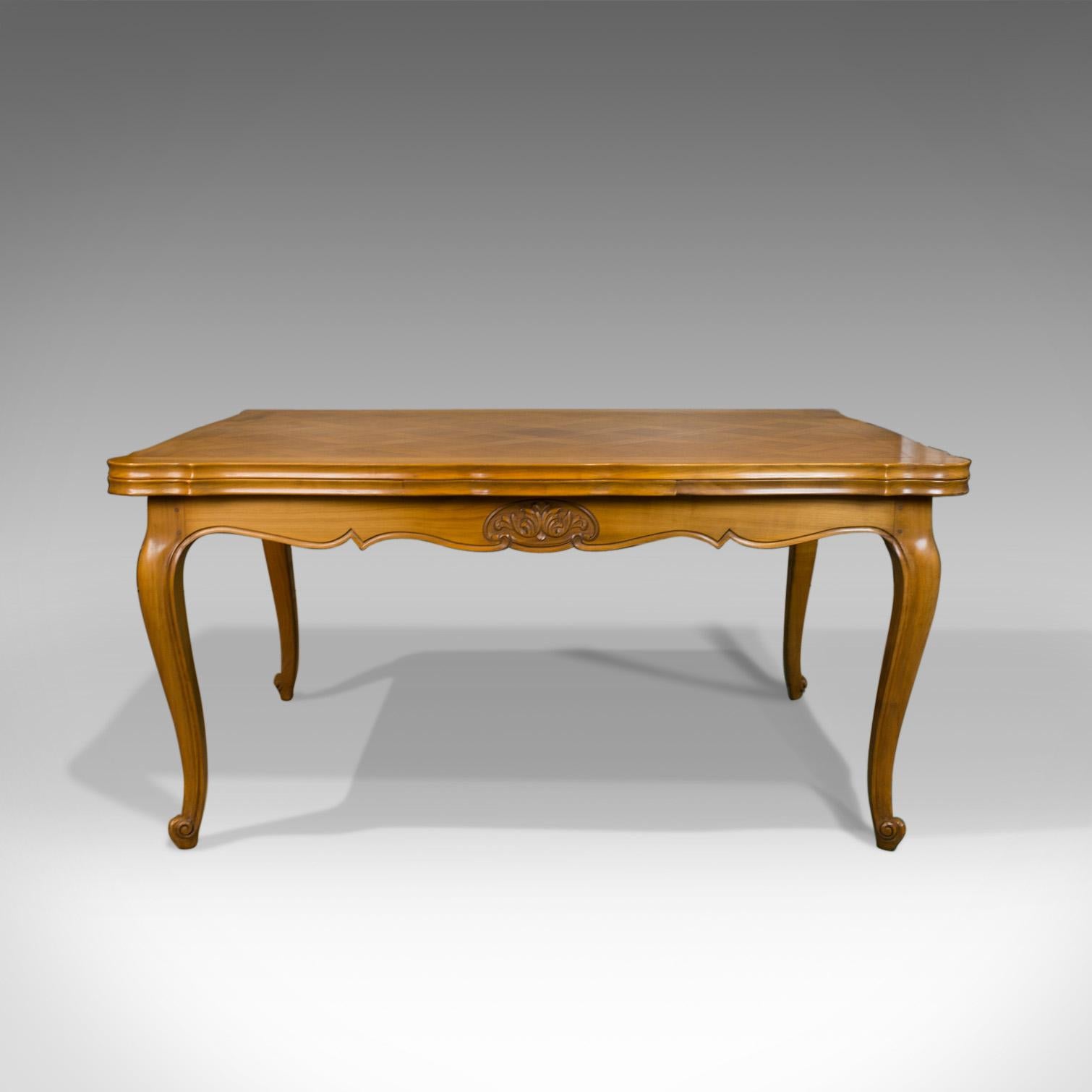 This is a French antique draw leaf dining table. A beech, extending table in the Louis XV-revival taste, seating up to 10 and dating to the early 20th century, circa 1930.

Delightful antique French farmhouse table
Seating six closed or up to ten