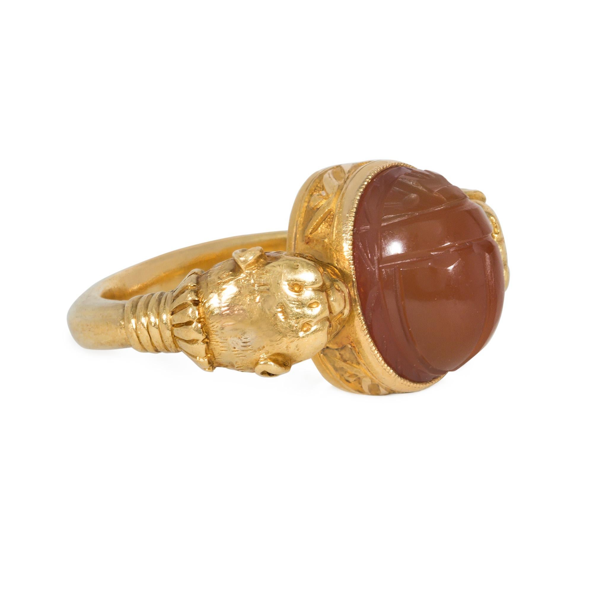 French Antique Egyptian Revival Gold and Carnelian Scarab Ring with Lion Heads In Good Condition For Sale In New York, NY