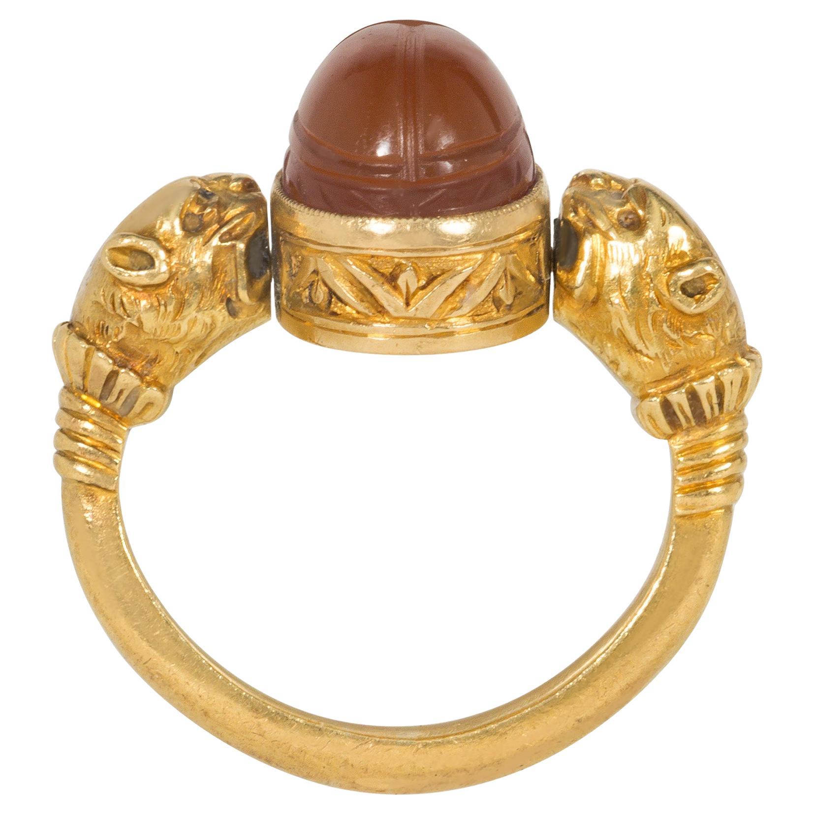 French Antique Egyptian Revival Gold and Carnelian Scarab Ring with Lion Heads