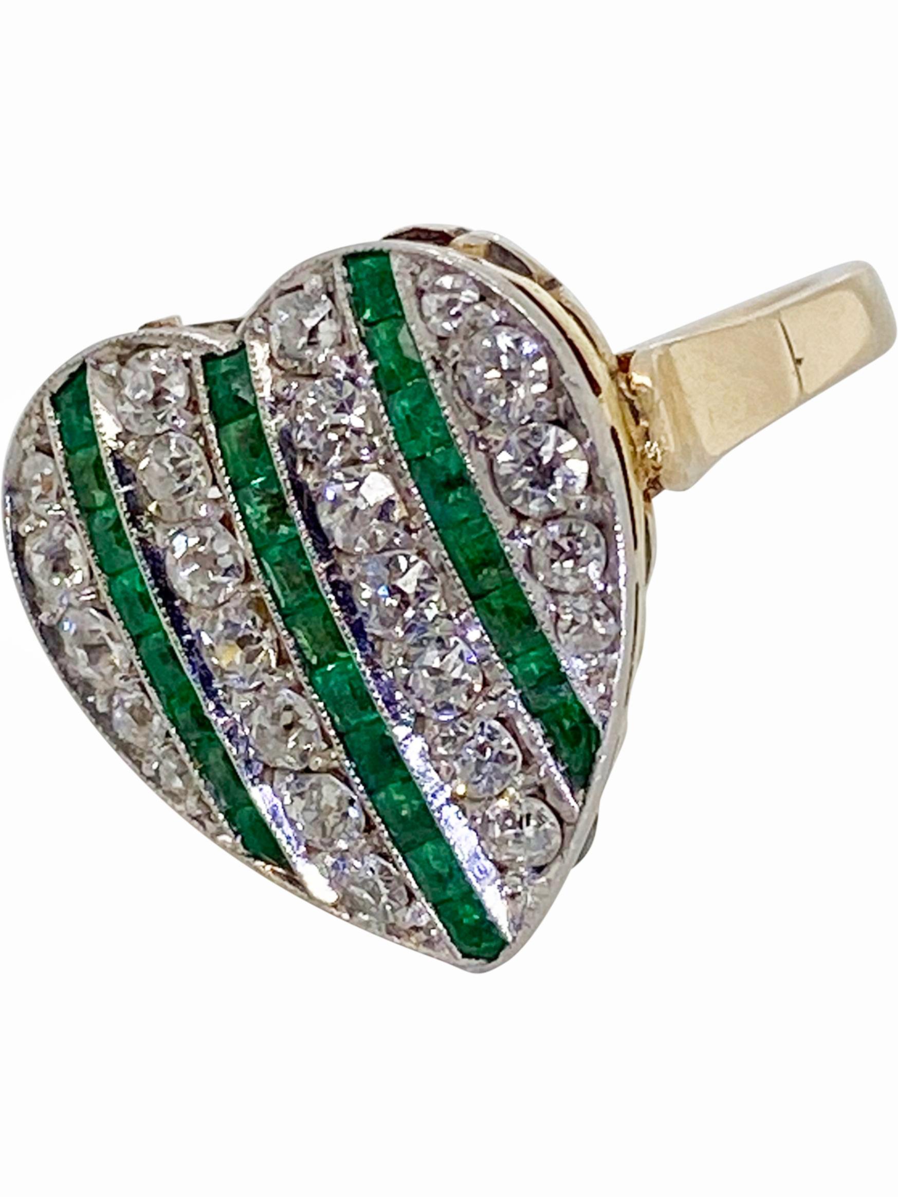 A ring to represent romance, the classic heart shaped style is timeless and has so much appeal. It represents love and what's not to love about this gorgeous style. Three rows of step cut emeralds run through the heart all mounted in platinum with
