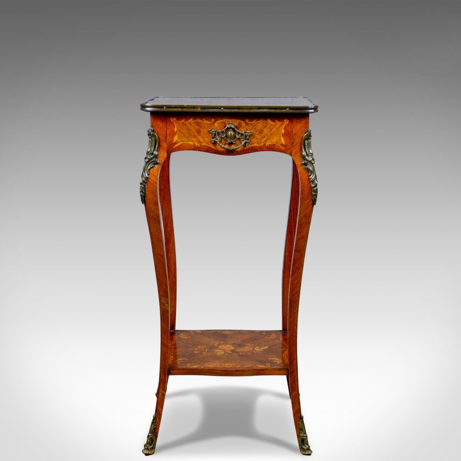 This is a French antique étagère, a kingwood side table or nightstand retailed by Druce & Co., London in the late 19th century, circa 1870.

Superior craftsmanship in the finest timbers
Rich, warm honey hues to the select kingwood 
The quarter