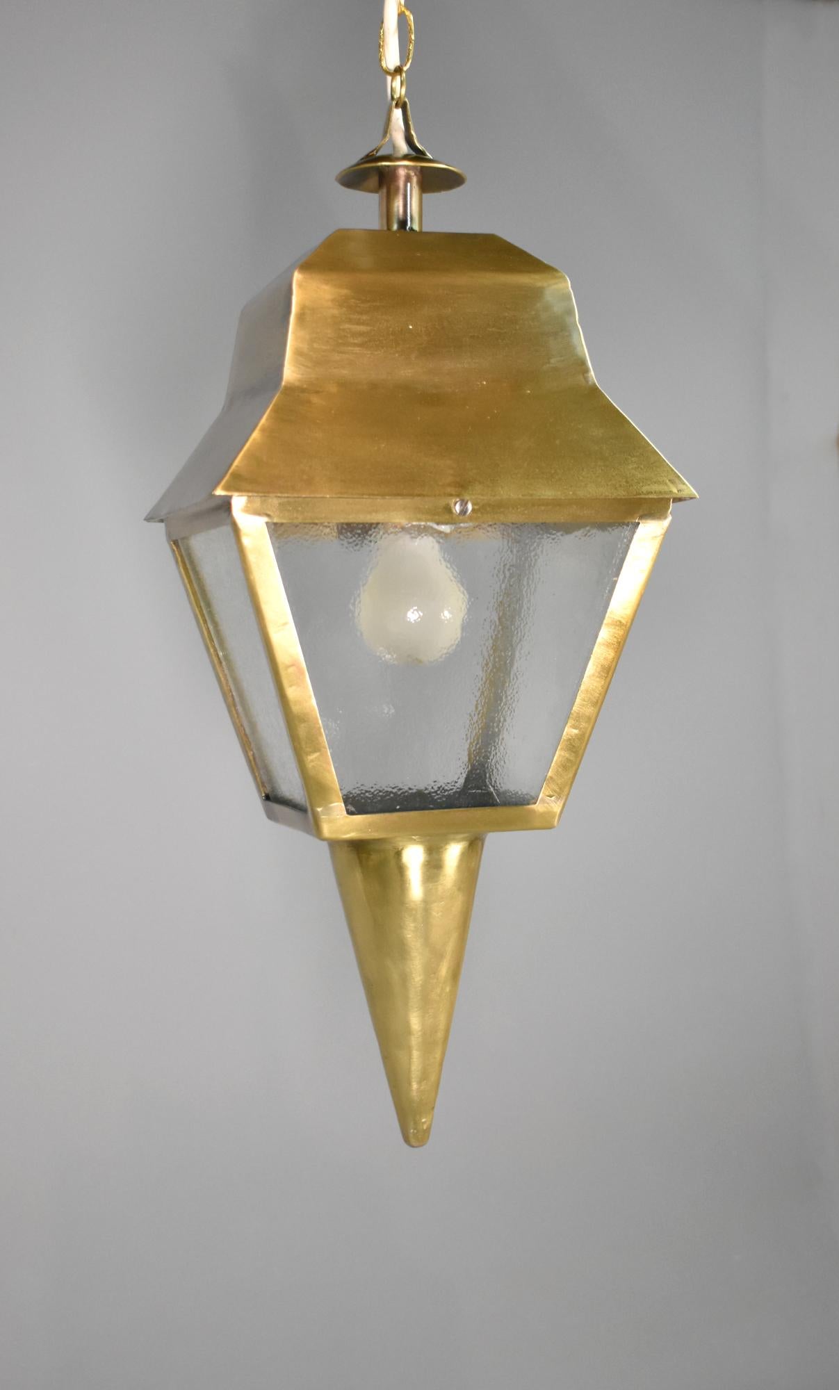 French Antique Exterior Bronze Lantern
 
This large French Exterior Bronze Lantern hangs from a turret top with a sloping canopy.
 
Below there are four frosted glass panels that softly diffuse light from the housed bayonet light bulb.
 
Built to