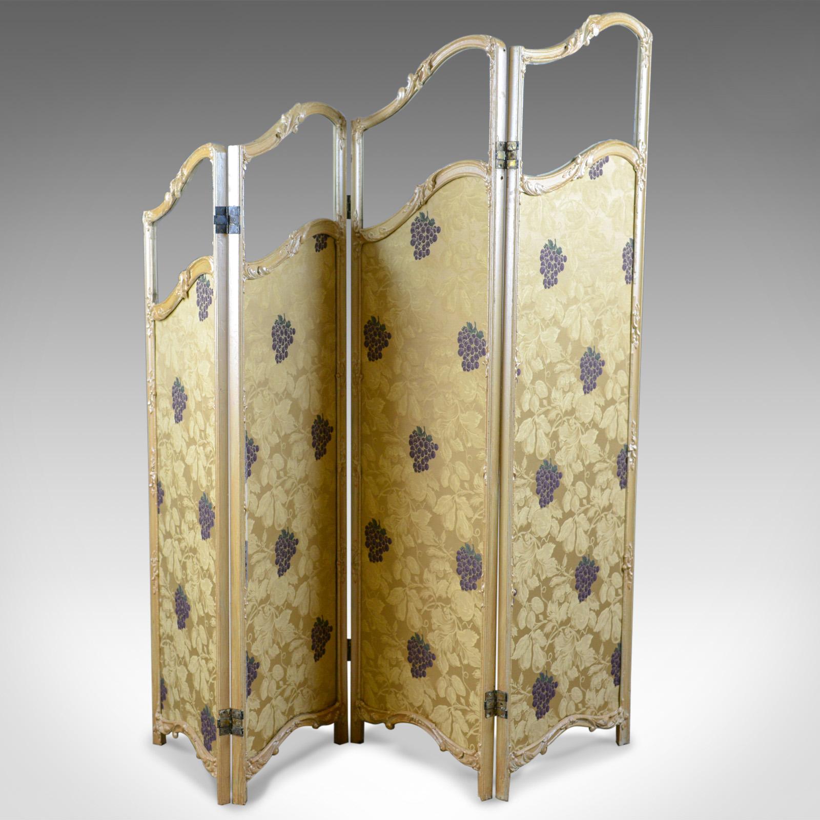 This is a French antique folding screen, a giltwood and needlepoint room divider, or photographer's prop, dating to the late 19th century, circa 1890.

Attractive, four fold, graduated screen, often referred to as 'Waterfall'
In fine order and of