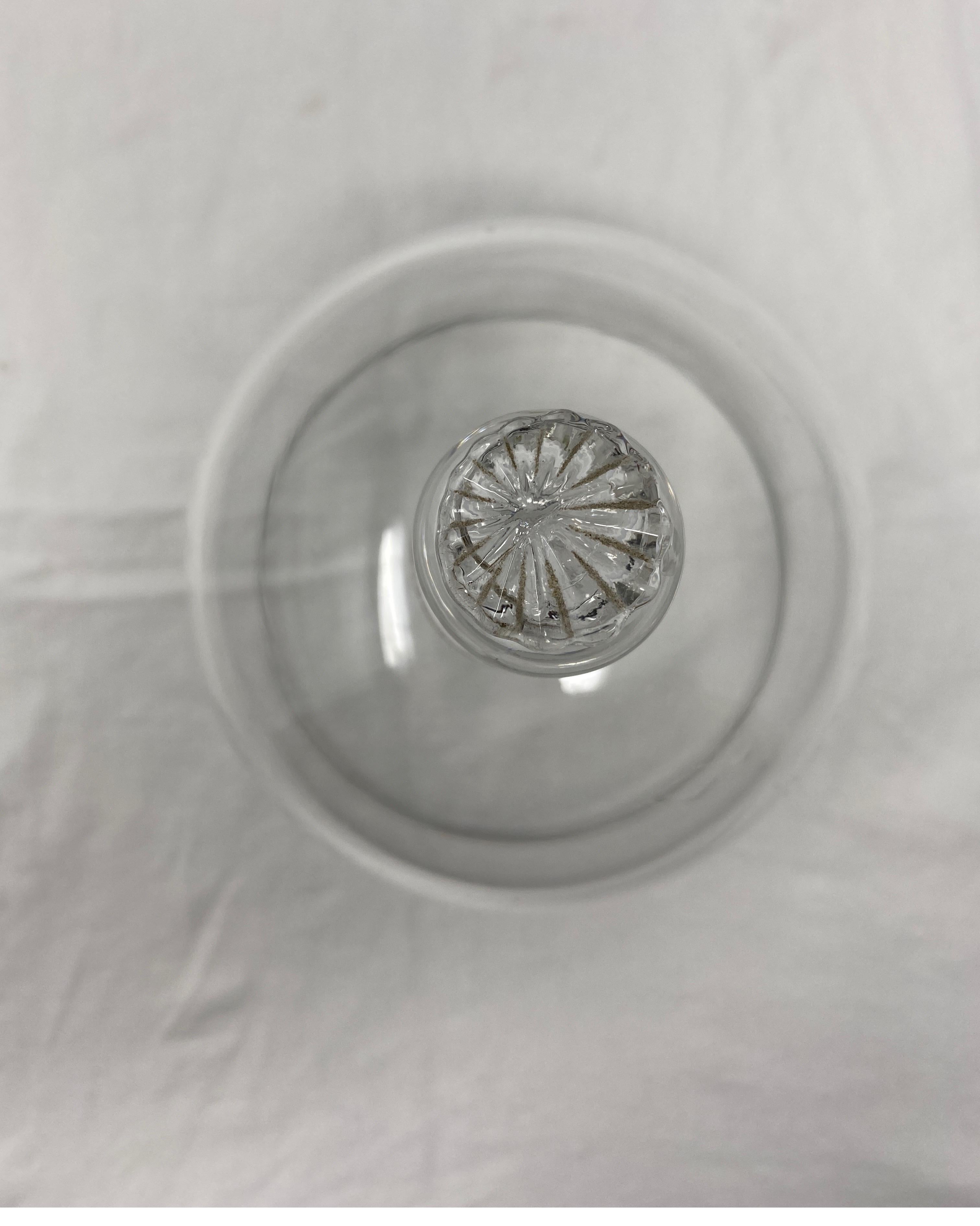 French antique glass dome cloche with a solid glass knob handle. Smooth and polished glass, these were used in French cheese shop's and patisseries to cover and display cheeses and baked goods.
 