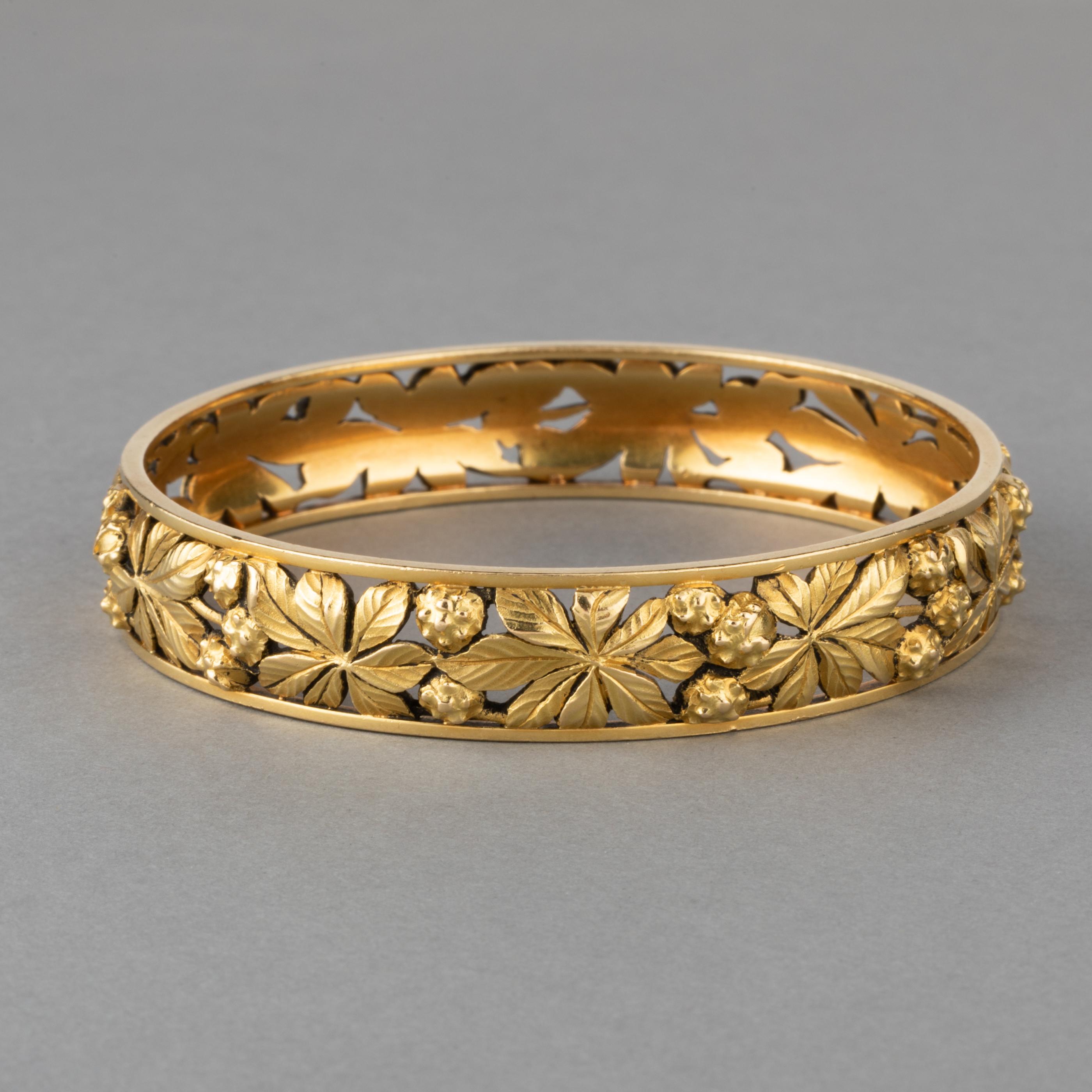 A very lovely bracelet, made in France circa 1880/1900, end of 19th century, begining of Art Nouveau Era.

It is made in yellow gold 18k, it is heavy and weights 52.30 grams.

The diameter is 6.7 cm, the turn is 18.5 cm. The width is 12mm. French