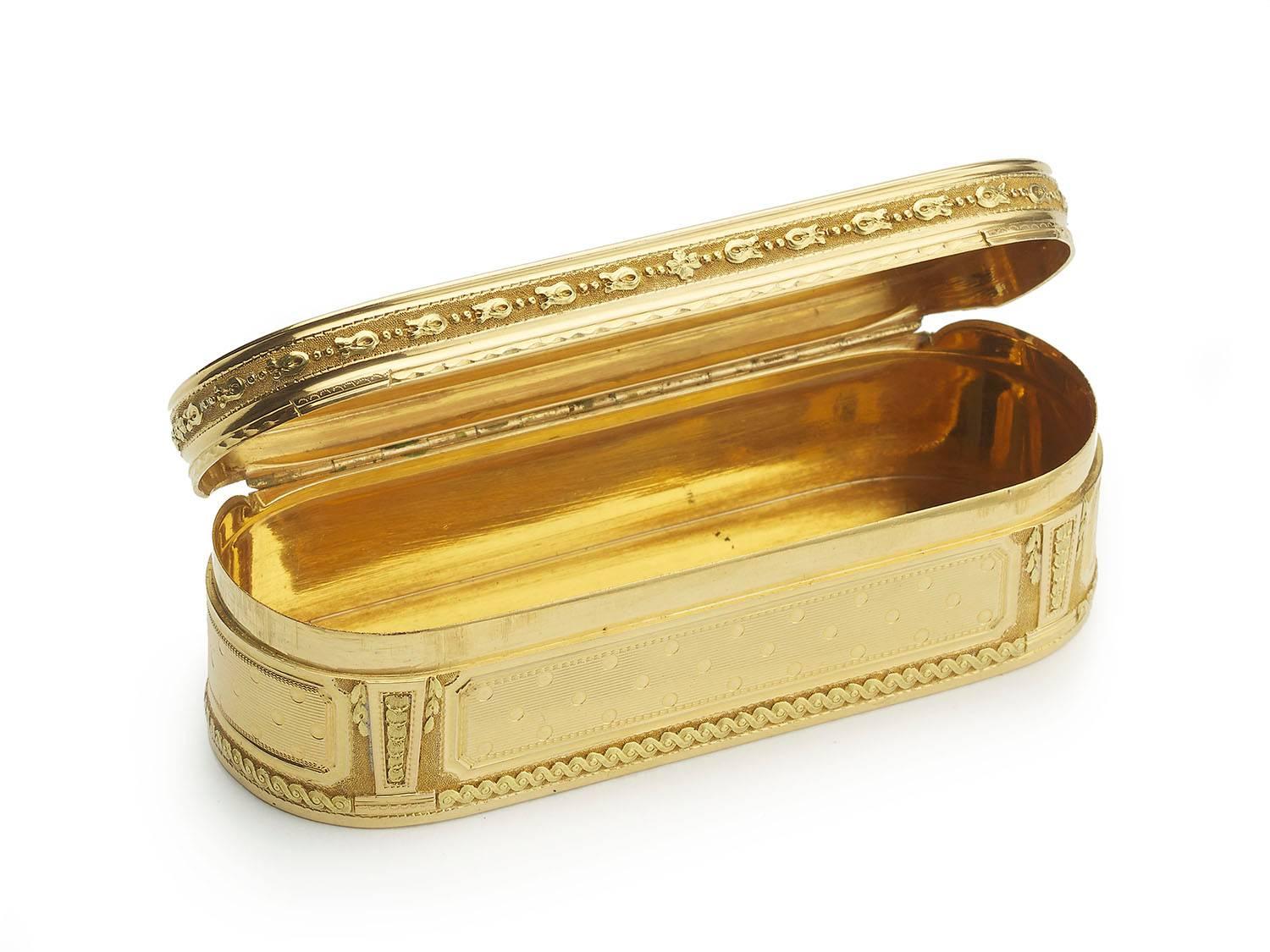 An antique, 18th century, gold box, the centre of the lid is decorated with engine turned dots on a lined background, with a garland surround on a textured background, the base is decorated in the same manner, the sides have the dot and line