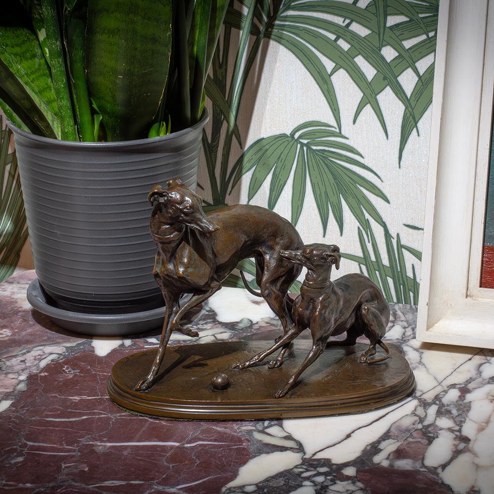 PLAYING GREYHOUNDS BRONZE FIGURE 

From our antique Bronze Sculpture collection, we are delighted to introduce to the market this French Greyhound Bronze Figure by Pierre-Jules Mene. The Bronze Figure stood on an oval stepped base depicting two