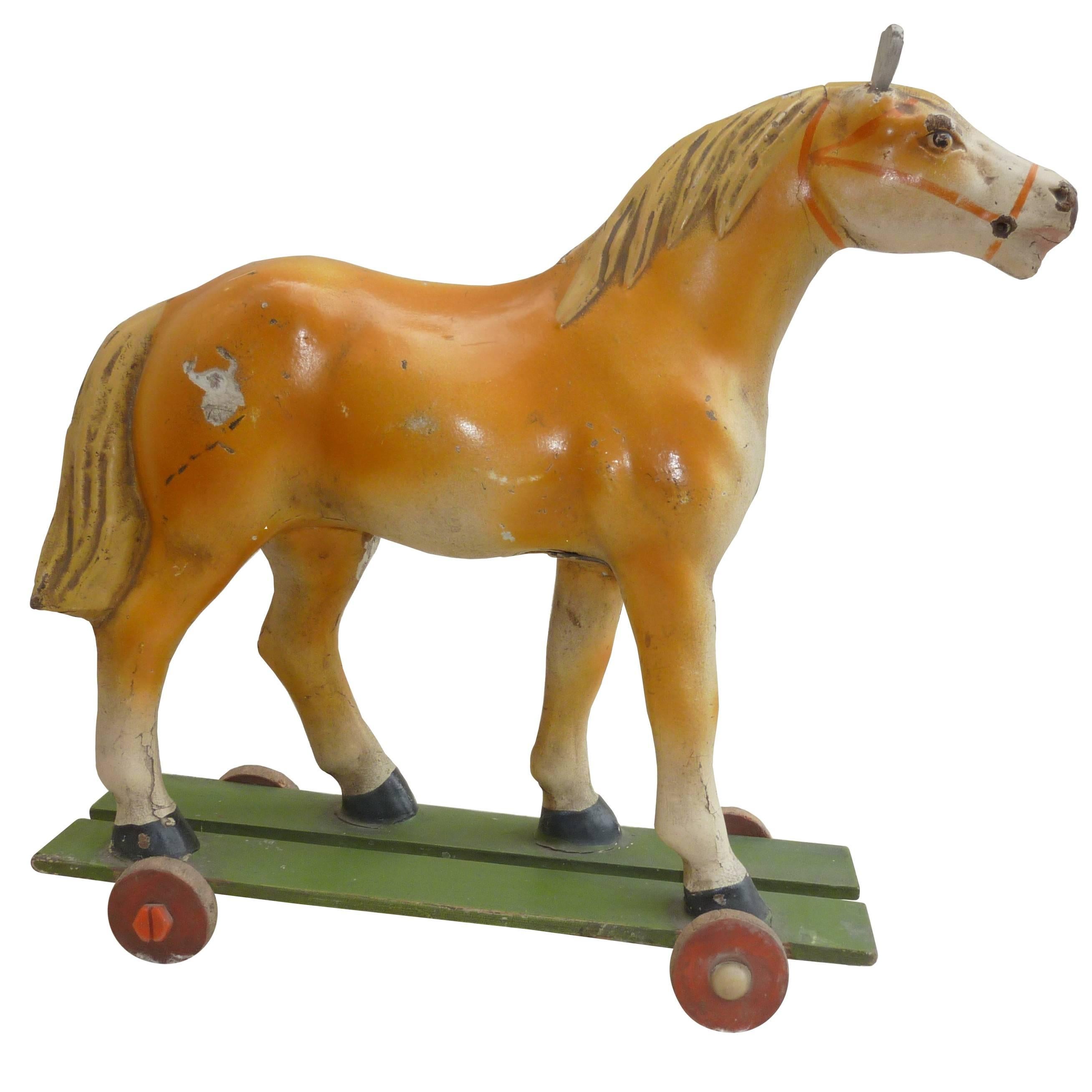 antique toy horse on wheels