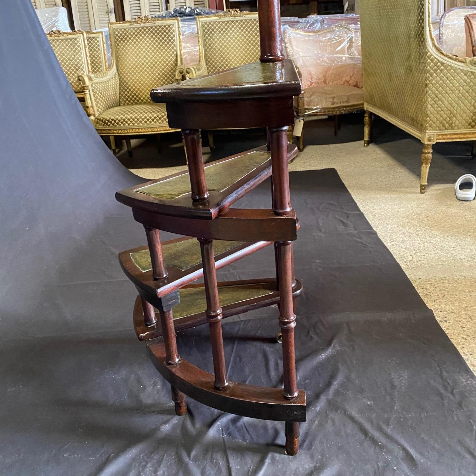 Add elegance to your living space - and reach higher with these lovely faux bamboo architectural spiral library steps in solid mahogany and classic French craftsmanship, perfect for adding a sophisticated touch to any library or study. Can be