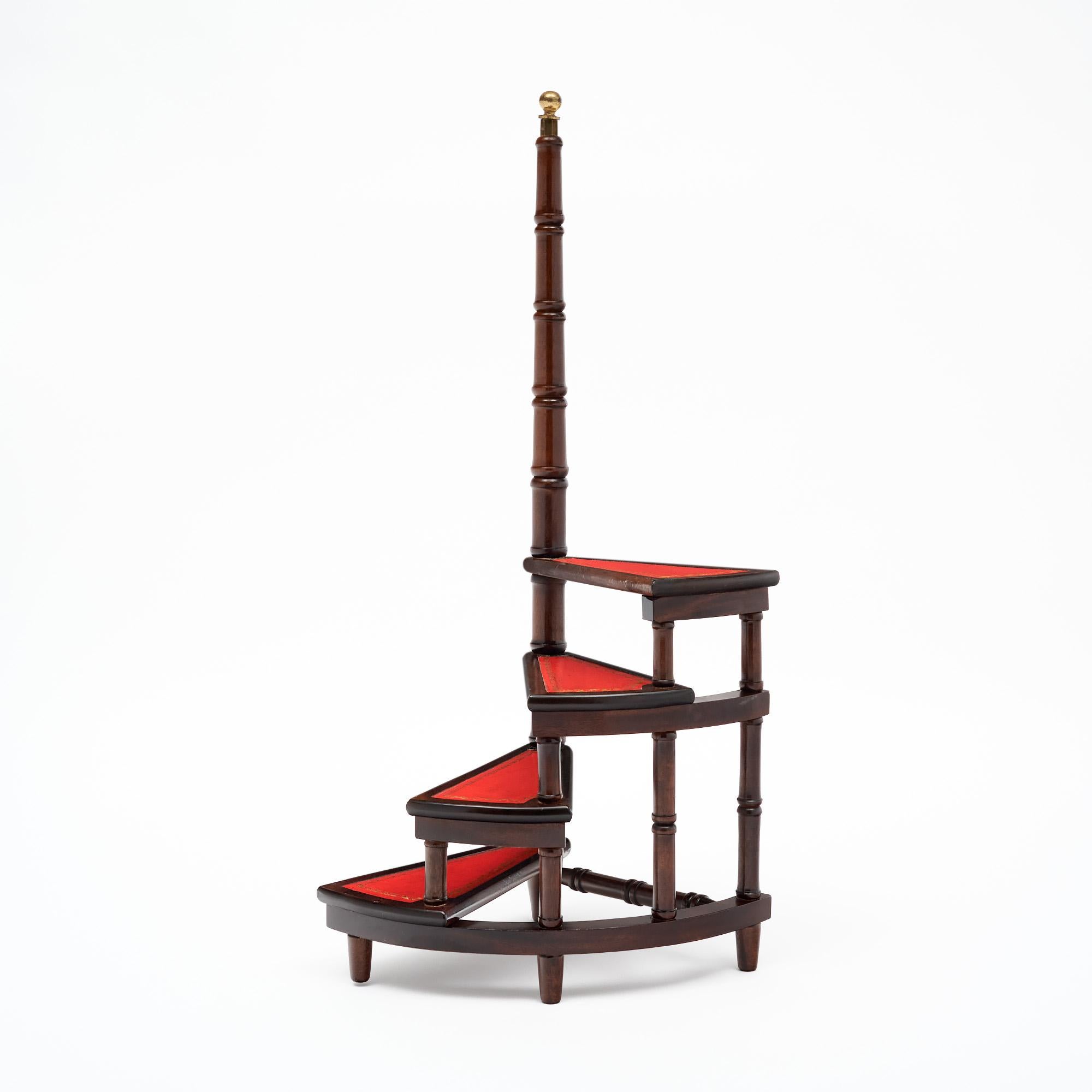 Library stairs from France made of solid wood construction, primarily walnut and finished with a lustrous French polish of museum quality. There are four steps lined with gilt embossed red leather and a holding stem finished with a gilt brass