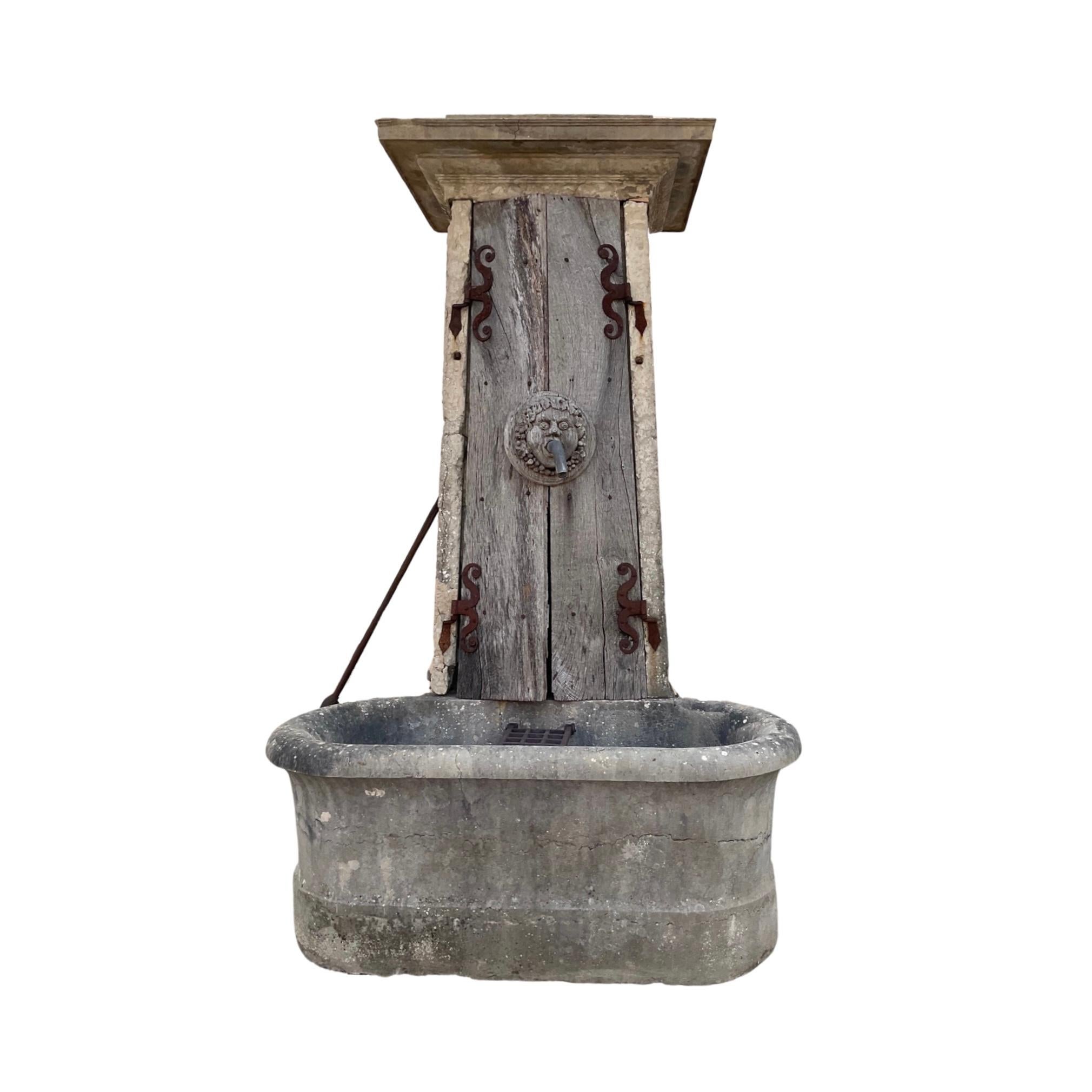 Bring the classic beauty of France to any outdoor space with this French Antique Limestone Fountain. Crafted out of hand-selected limestone, the fountain features a front basin tub and a handheld water bar pump for a timelessly elegant design. Enjoy