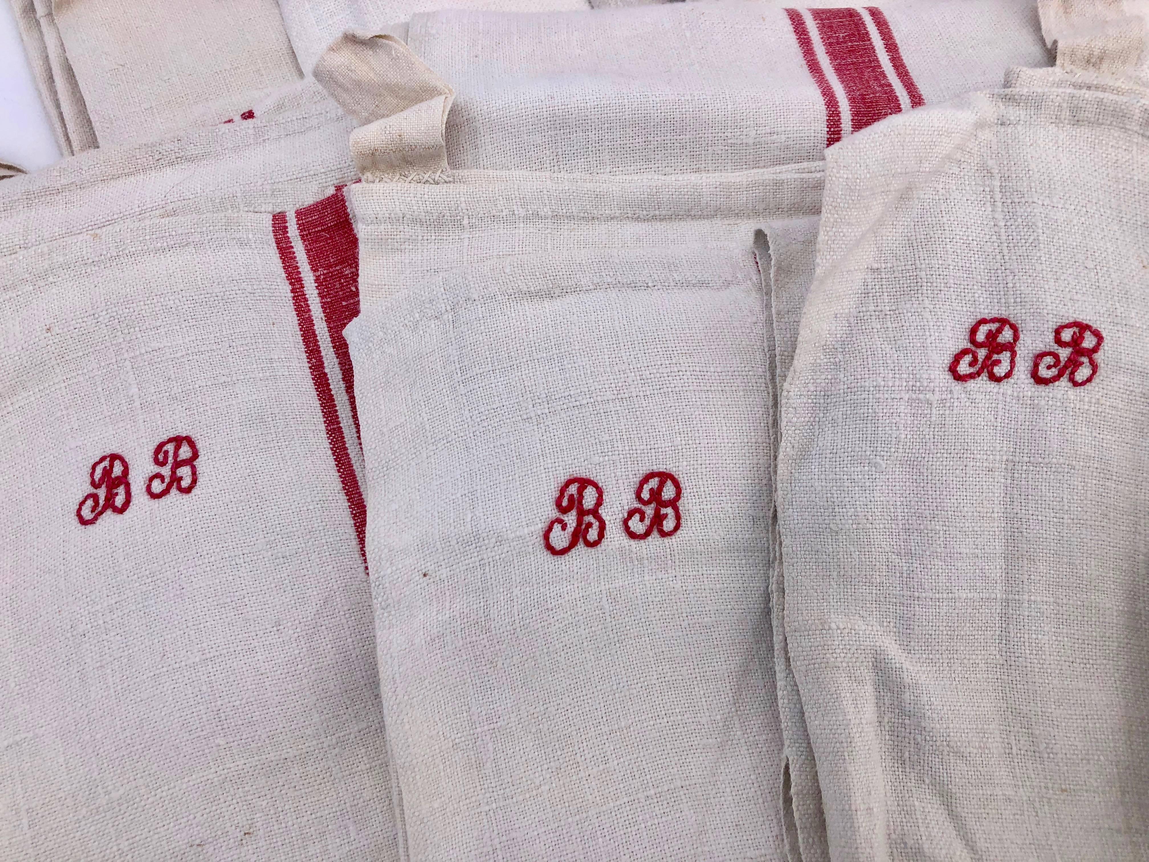 These lovely French antique linen kitchen towels are a set of 14 and all are embroidered with red 