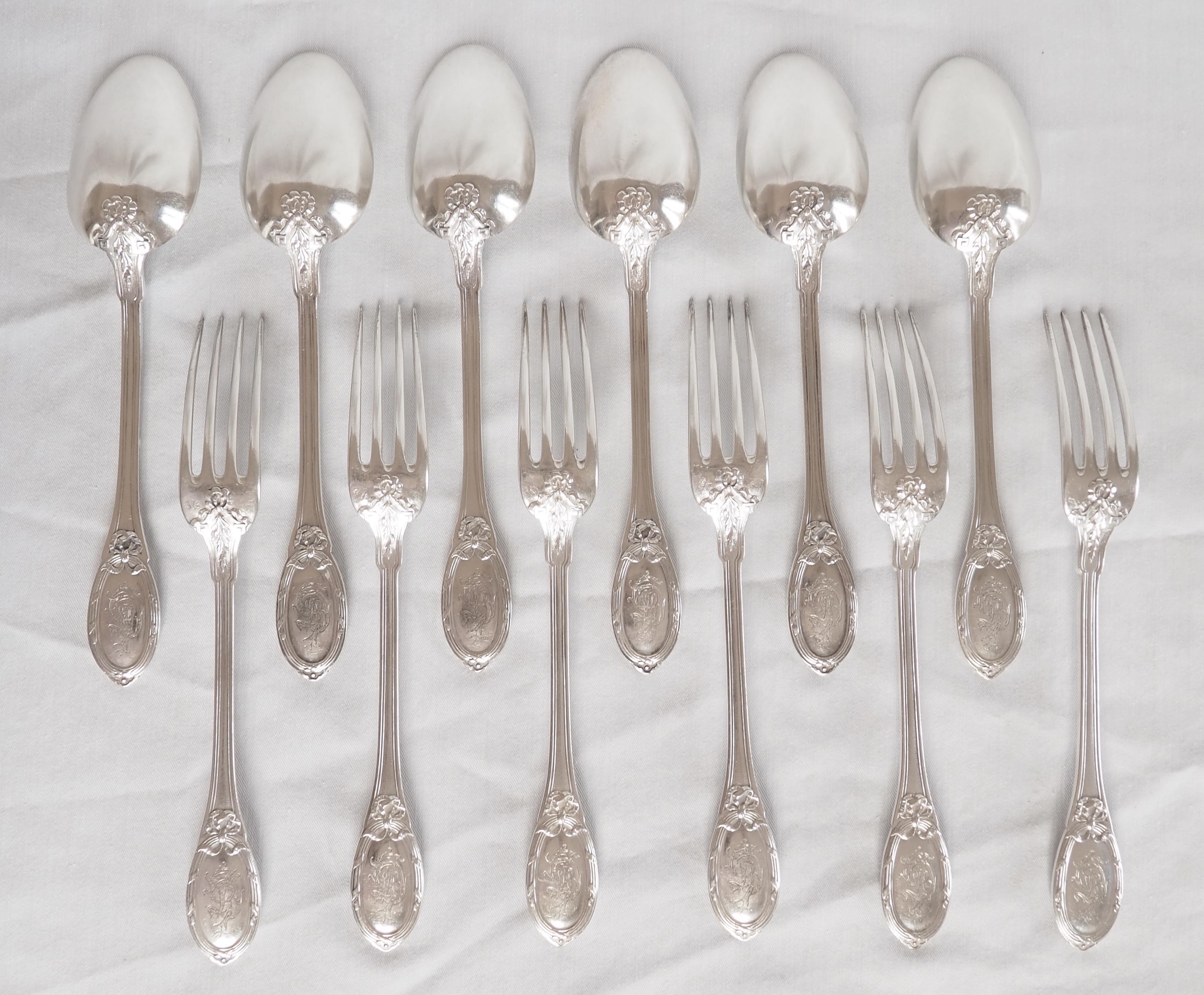 Louis XVI style sterling silver flatware for 6 : 12 pieces composed of 6 table forks and 6 table spoons.

Beautiful pattern decorated with ribbons, acanthus, a GD monogram in the cartouche of each handle. This is a top-of-the-range model with a