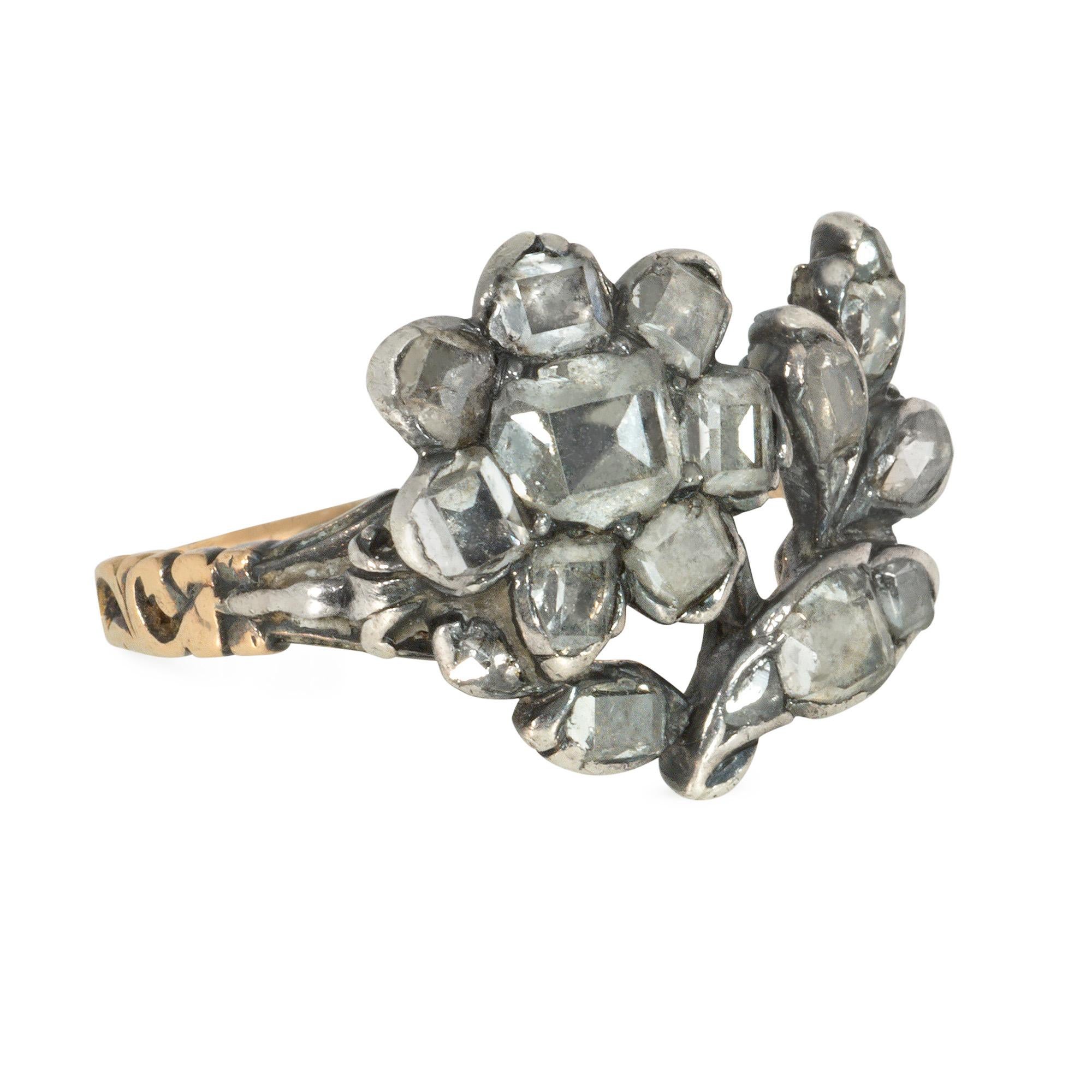 An antique Georgian period table-cut diamond giardinetto ring in the form of a flower, in sterling silver and 18k gold. France