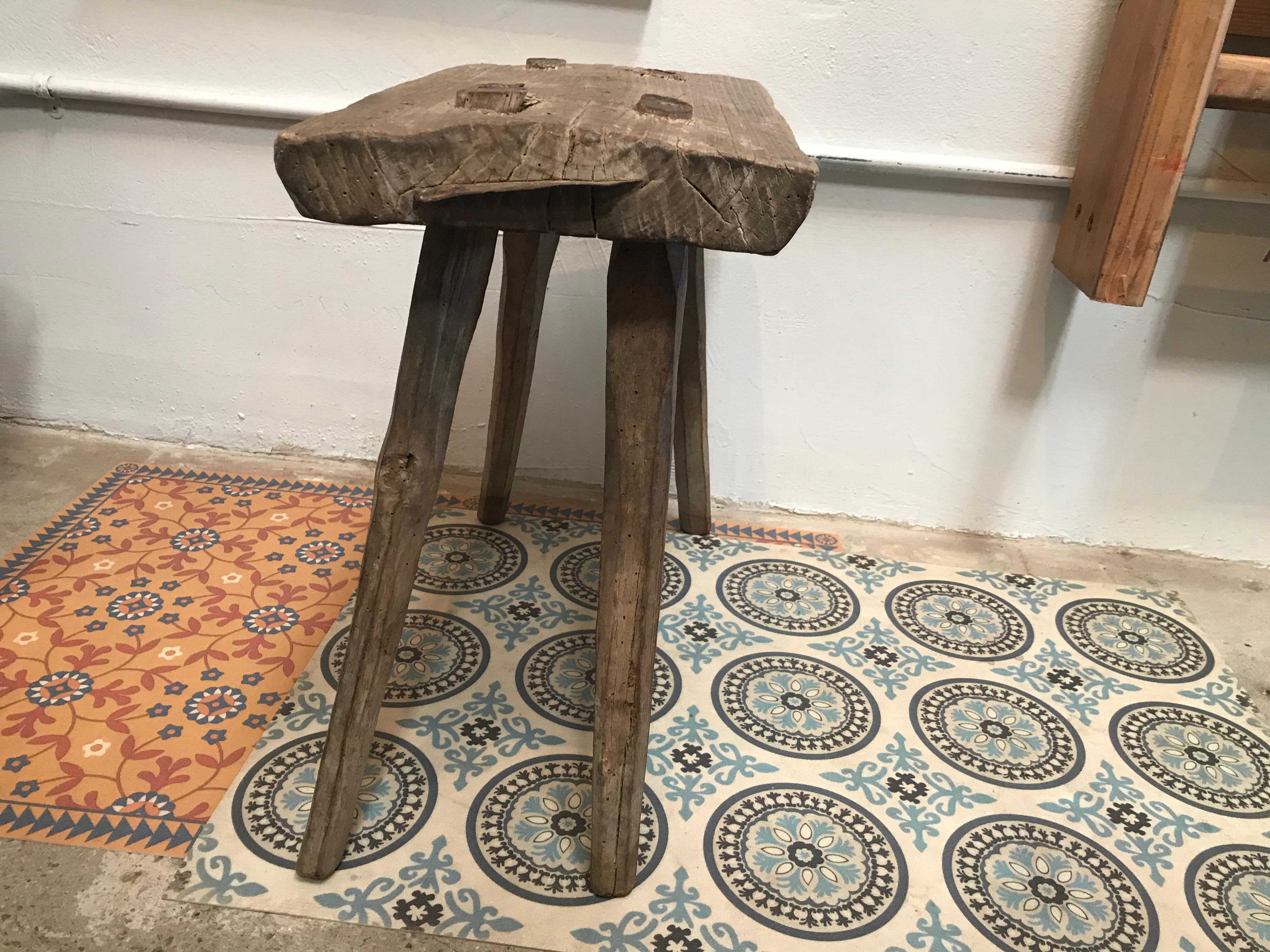 An antique from the French countryside, this vintage milking stool has aged beautifully.