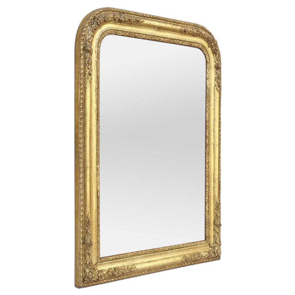 Antique Louis-Philippe French style giltwood mirror, circa 1860. Gilded wood antique frame with floral decoration of romantic inspiration and orned 