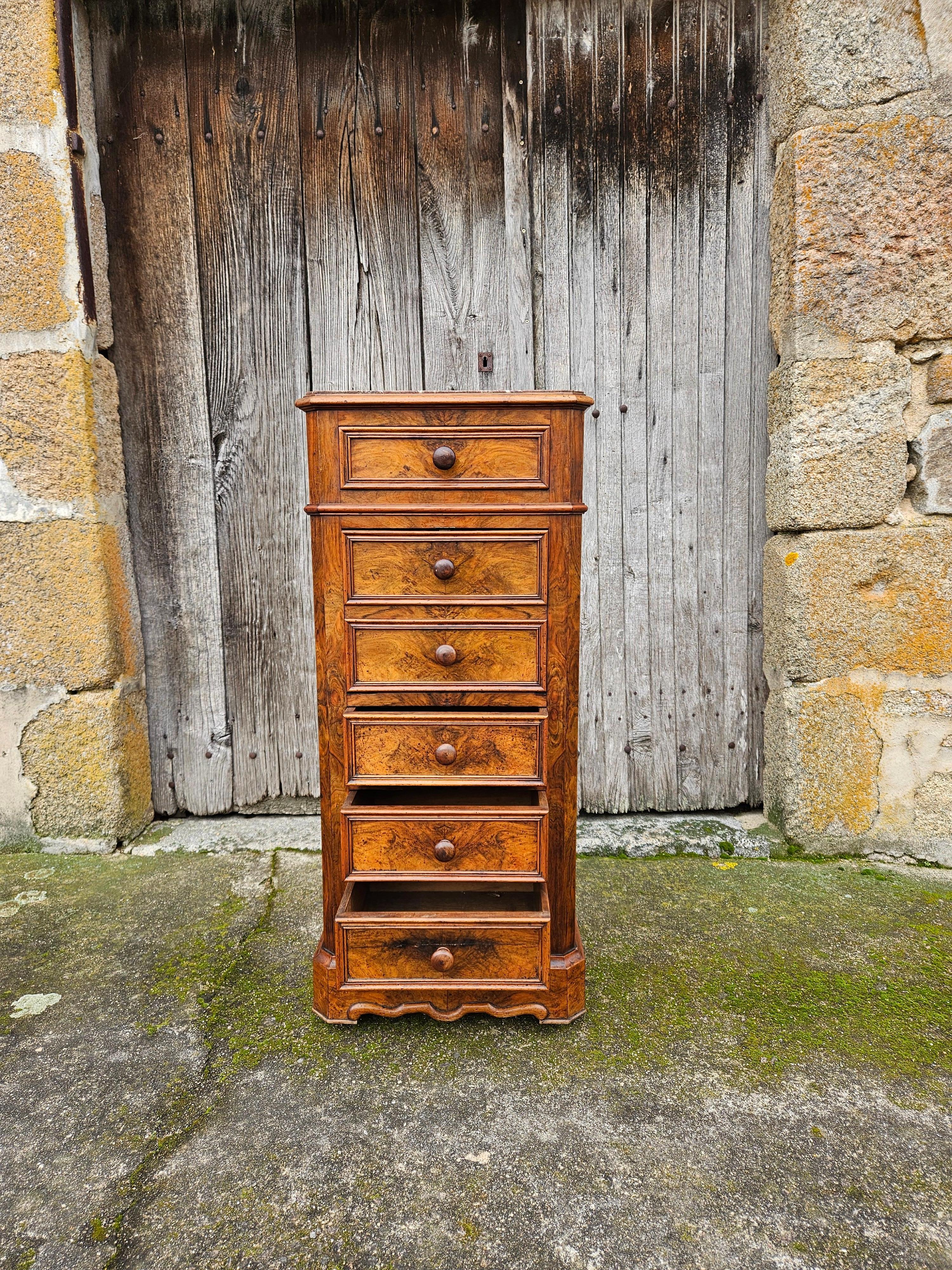 French Vintage Nightstand- Bedside Table - Bedside Console from the late 19th Century.
Made of walnut with veneer of burled Walnut Front - very solid handicraft .
It has four Drawers and a Door that hinges open to reveal an Interior Compartment,