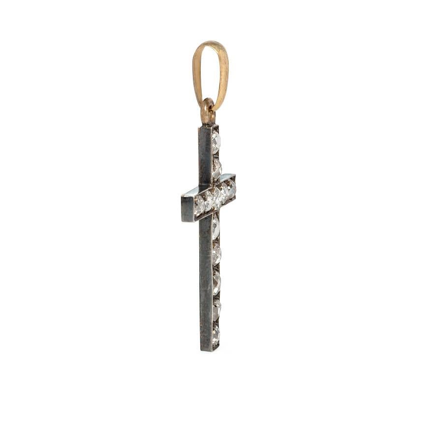 An antique old-mine cut diamond cross pendant in sterling silver-topped 18K gold.  France.  Atw 1.50 ct.  (Chain not included.)
Approximately 1 5/8